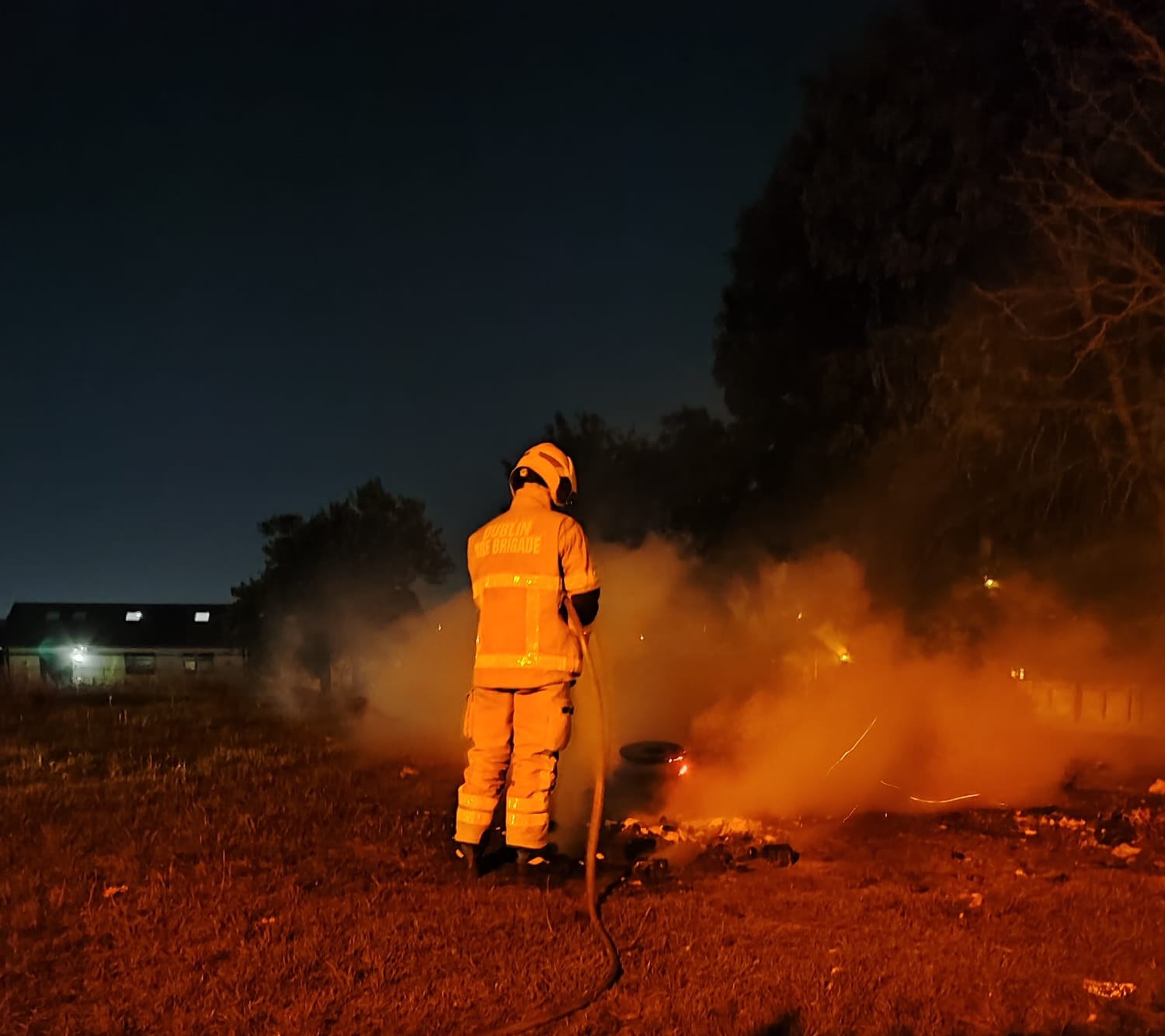 A firefighter extinguishing a fire near Portmarnock in Dublin on Halloween night