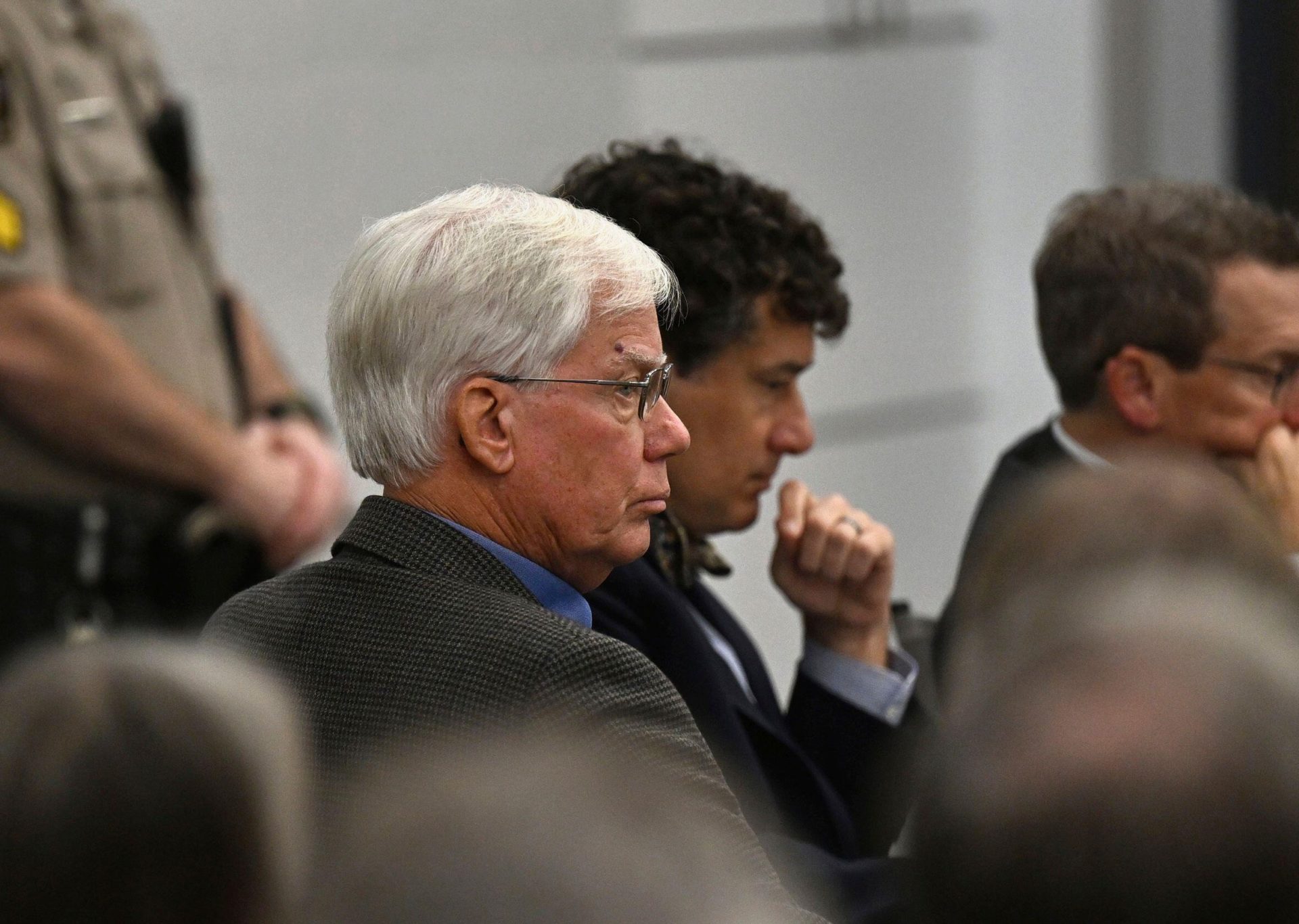 Thomas Martens (left, white hair) sits with attorneys during a hearing on Monday, October 30th 2023, for Martens and his daughter, Molly Corbett, in the 2015 death of Molly's husband, Jason Corbett at the Davidson County Courthouse in Lexington, North Carolina