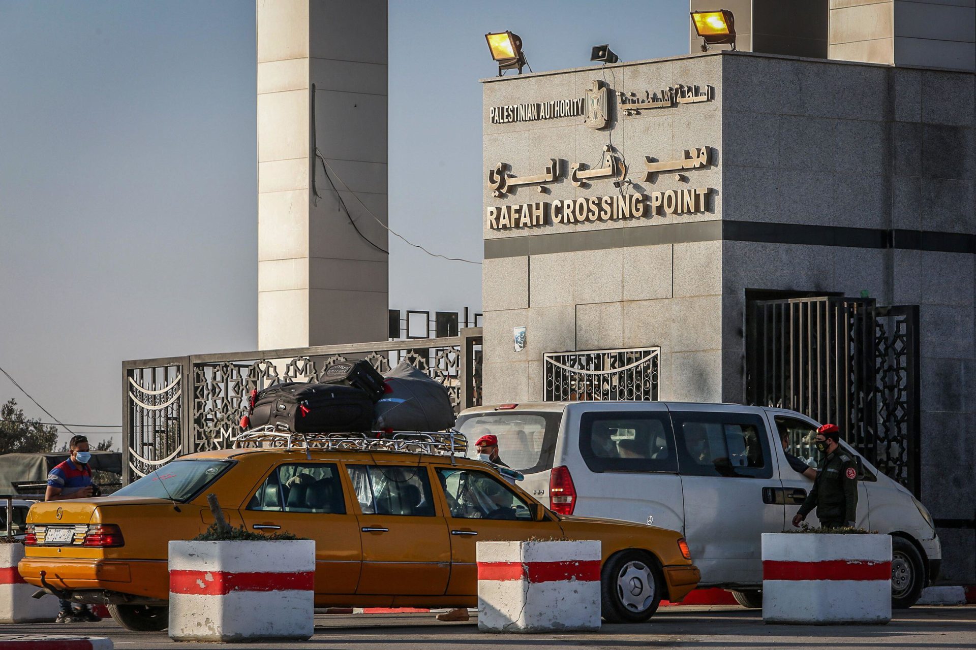 Palestinian officers check permits at Rafah Border Crossing in the southern Gaza Strip