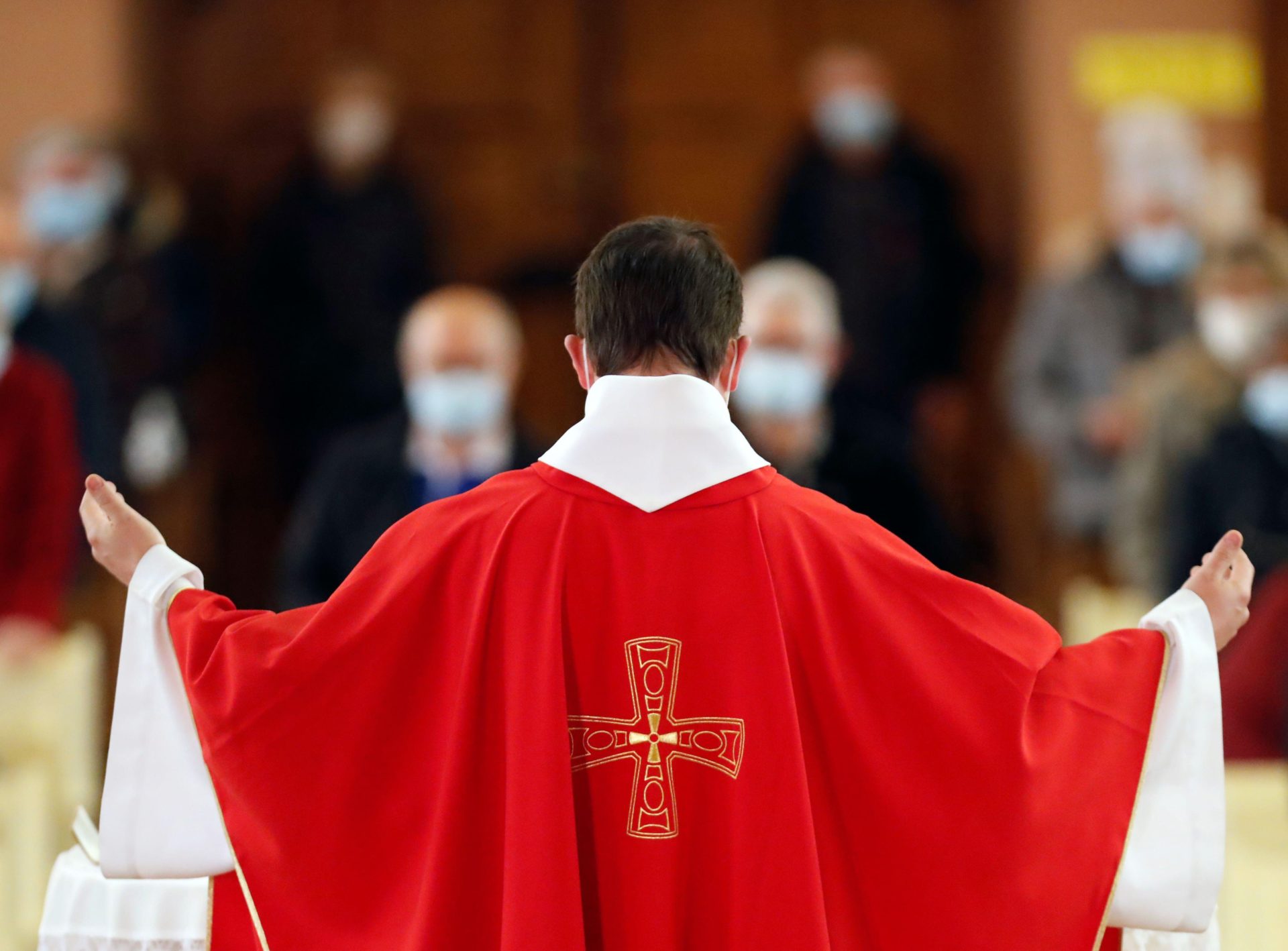 A priest saying mass at a church in France, 28-3-21