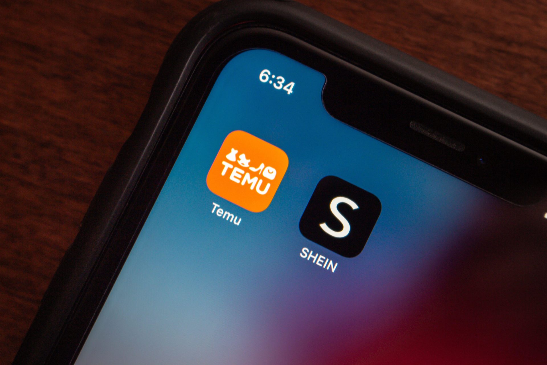 Online shopping platforms Temu and Shein app icons seen in an iPhone. Image: Koshiro K / Alamy Stock Photo