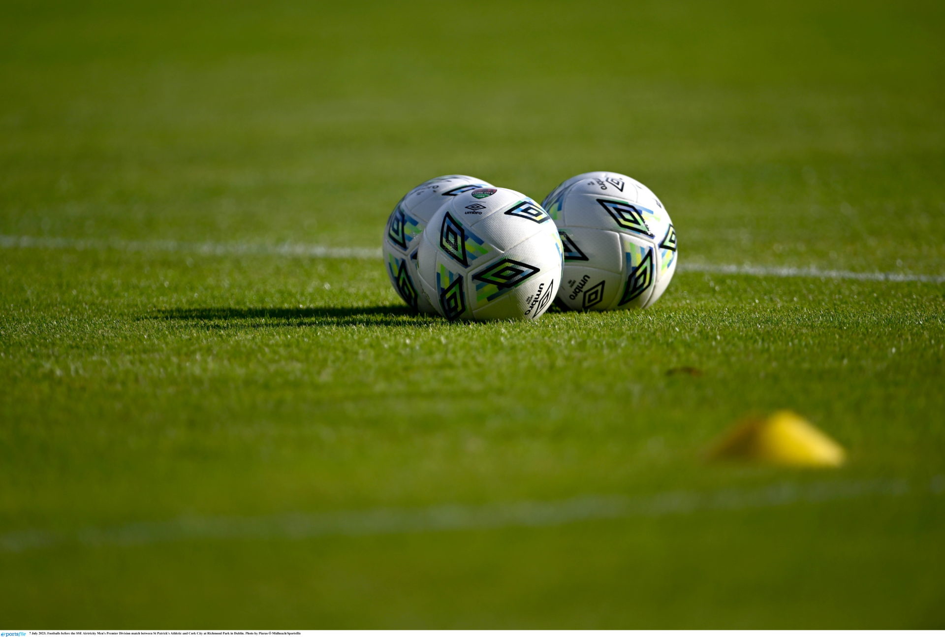 Main image shows footballs on a pitch.