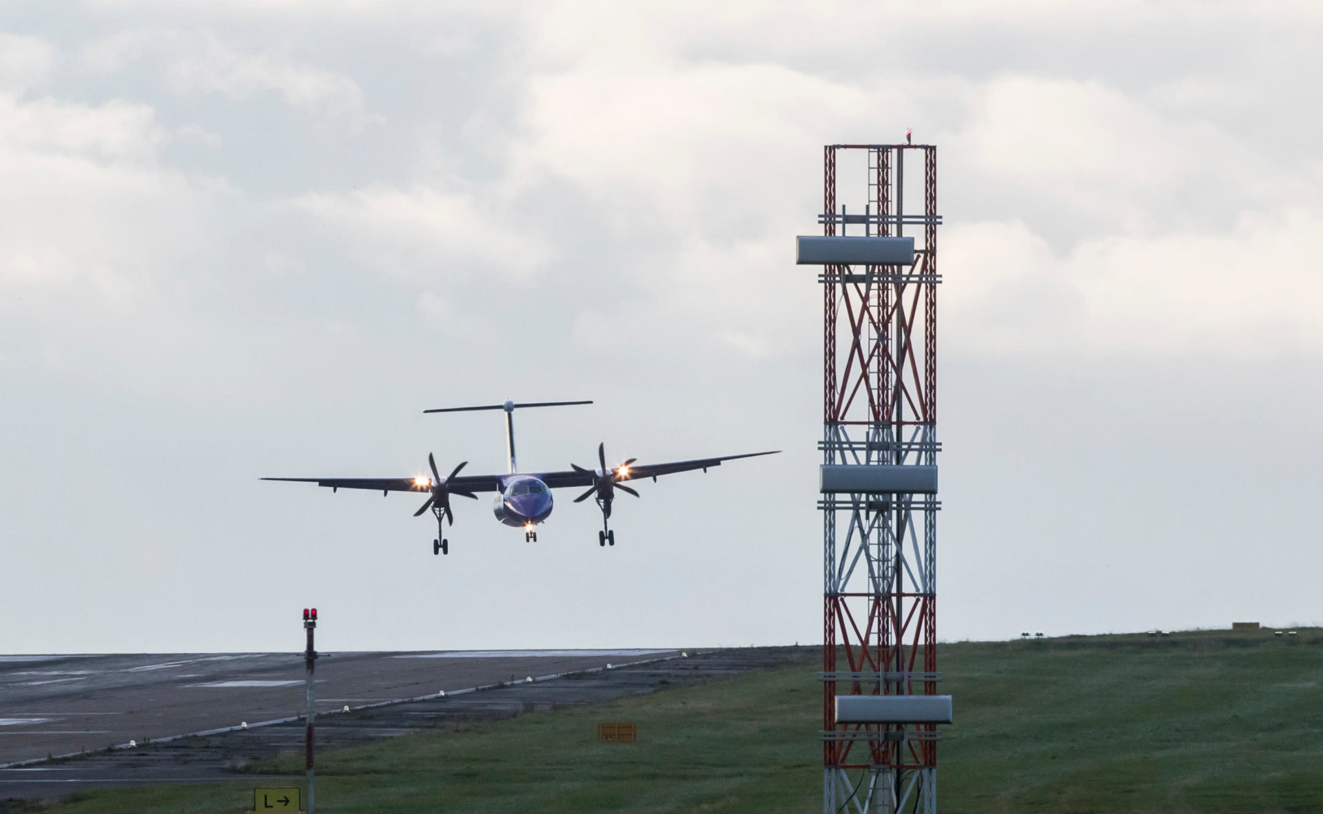 A plane lands at Leeds Bradford Airport as Storm Aileen brings howling gusts and heavy showers to parts of the UK.