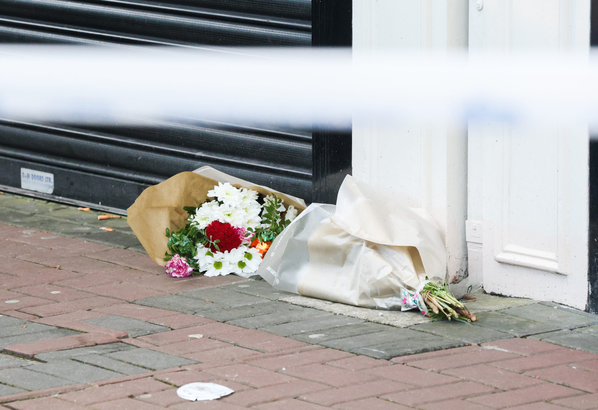 Flowers after the Christmas Eve shooting.