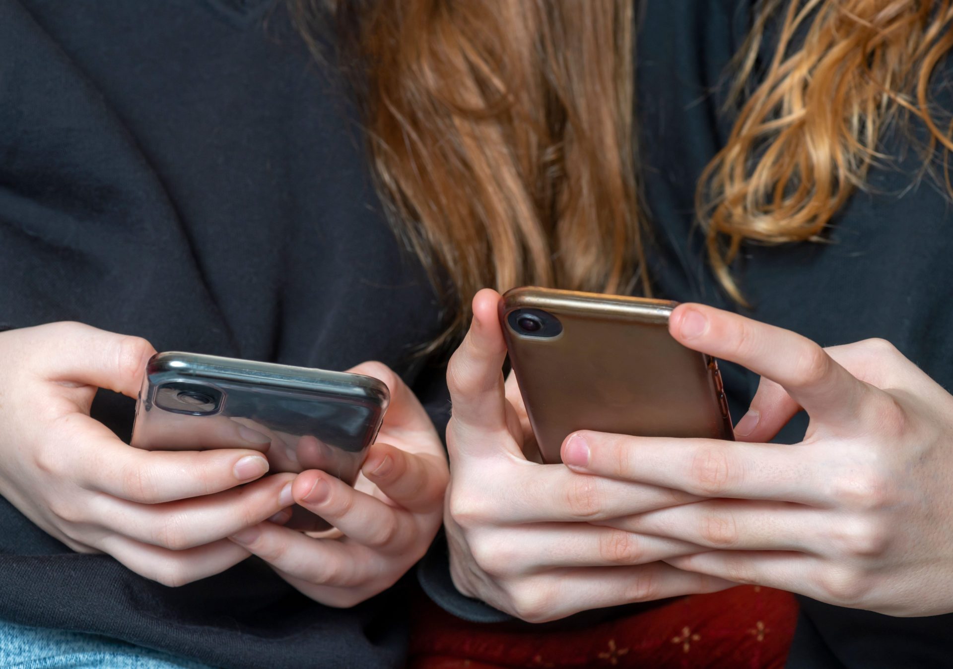 Teenage girls on their phones, 8-2-20.