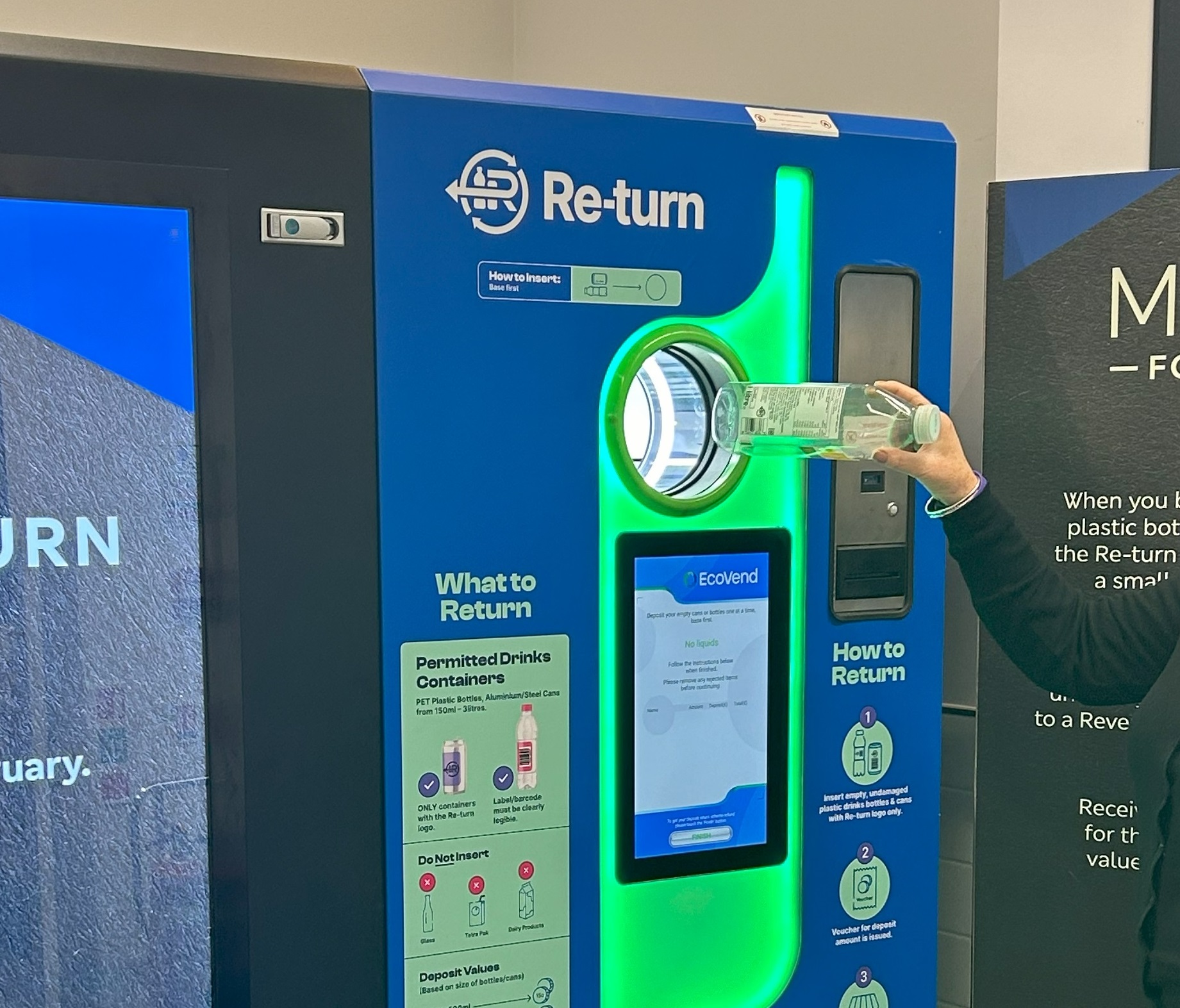 A worker demonstrates a Deposit Return Scheme Reverse Vending Machine in a Marks & Spencer supermarket in Dublin, 1-2-34