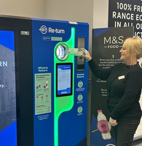 A worker demonstrates a Deposit Return Scheme Reverse Vending Machine in a Marks & Spencer supermarket in Dublin, 1-2-34.