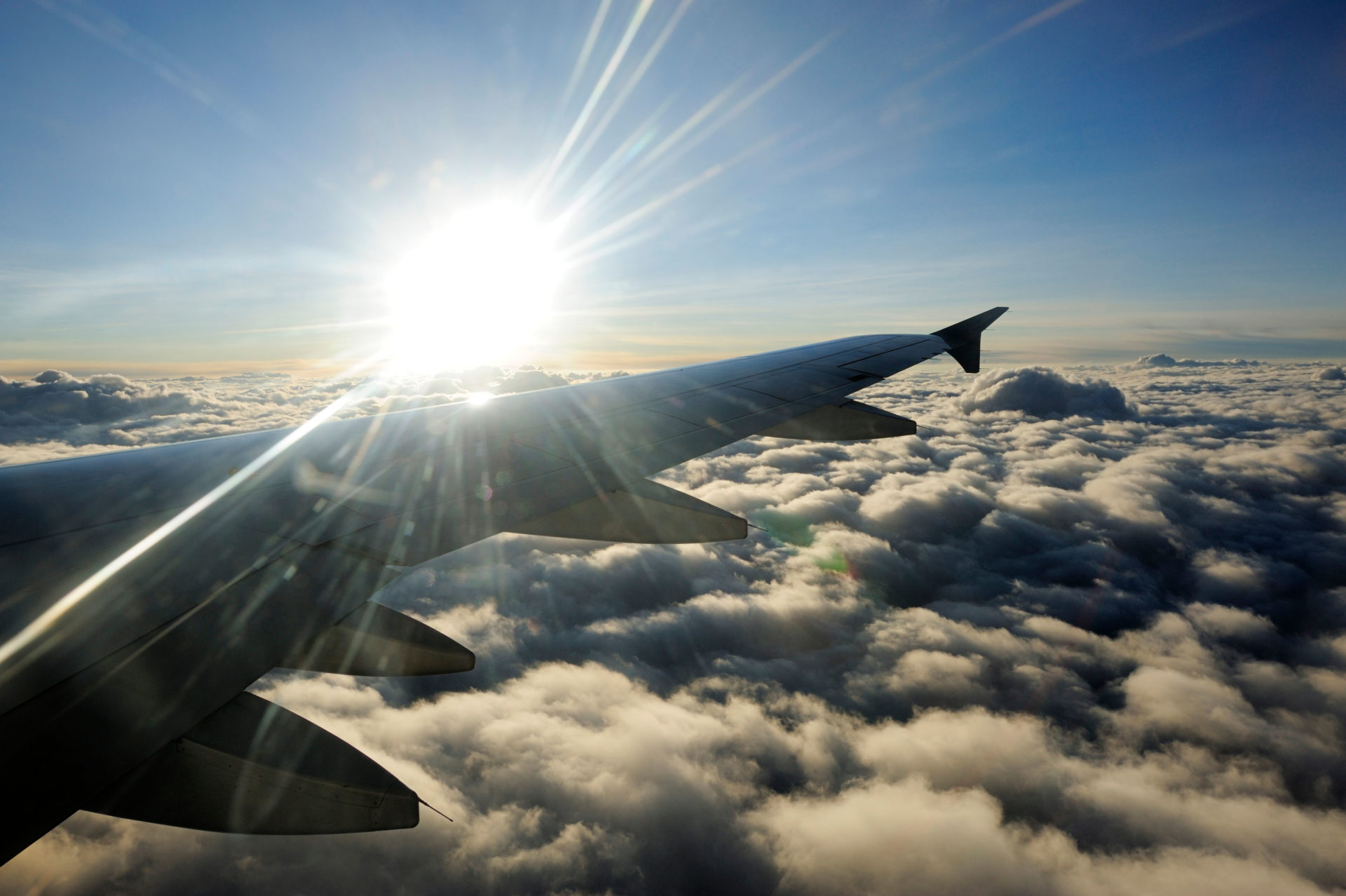 Sun above clouds with the wing of an airplane, 26-7-11.