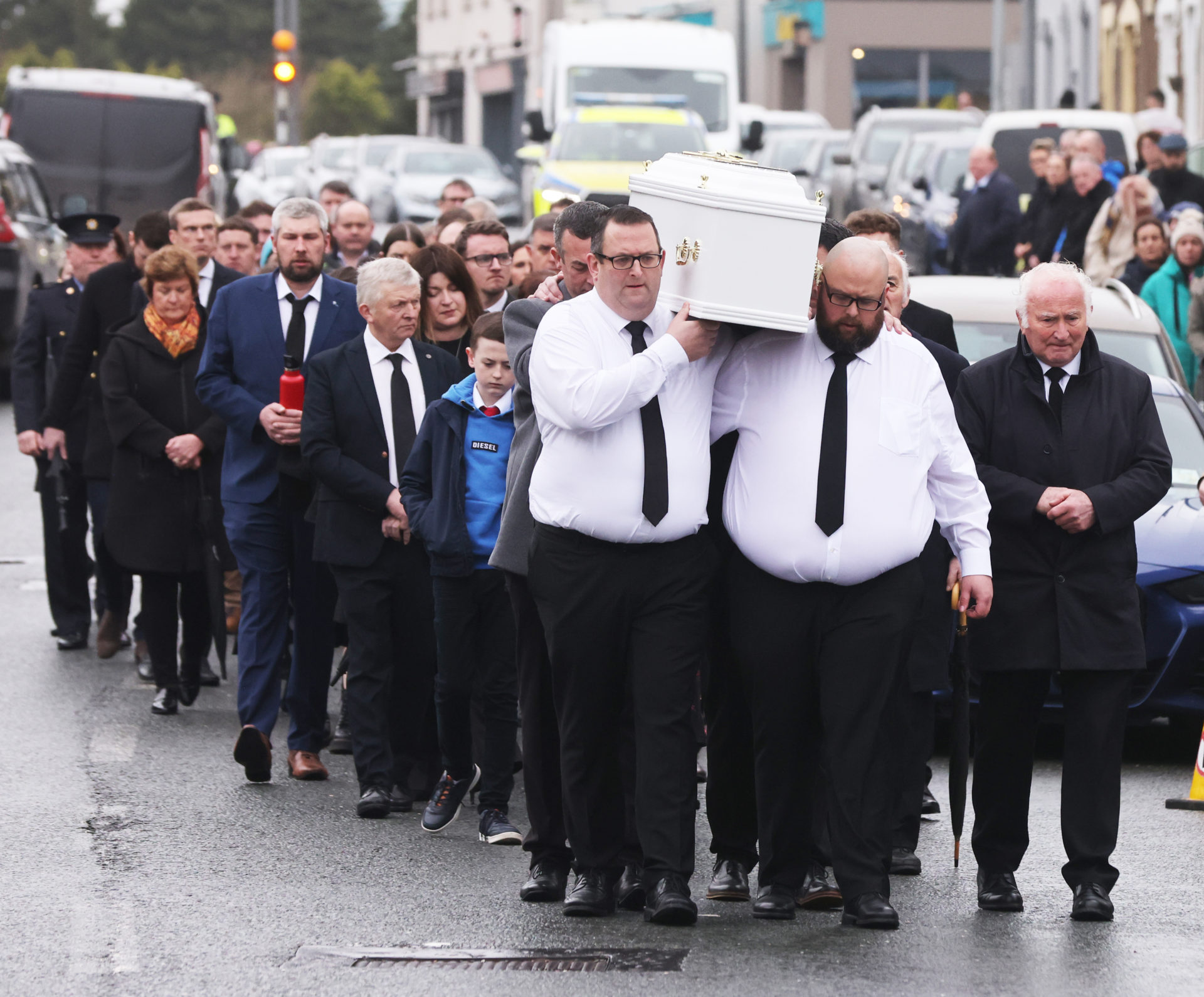 Mourners follow the coffin of Matthew James Healy into the Church of the Immaculate Conception in Cork, 14-2-24