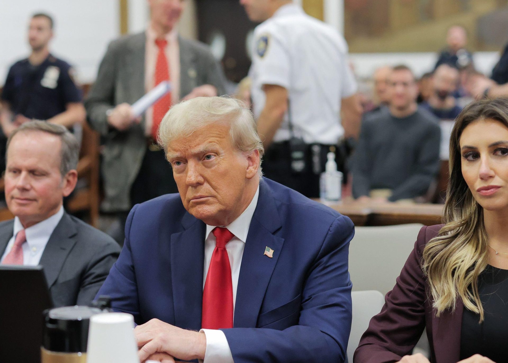 Donald Trump (centre) in a New York courtroom during his civil fraud trial, 17-10-23.