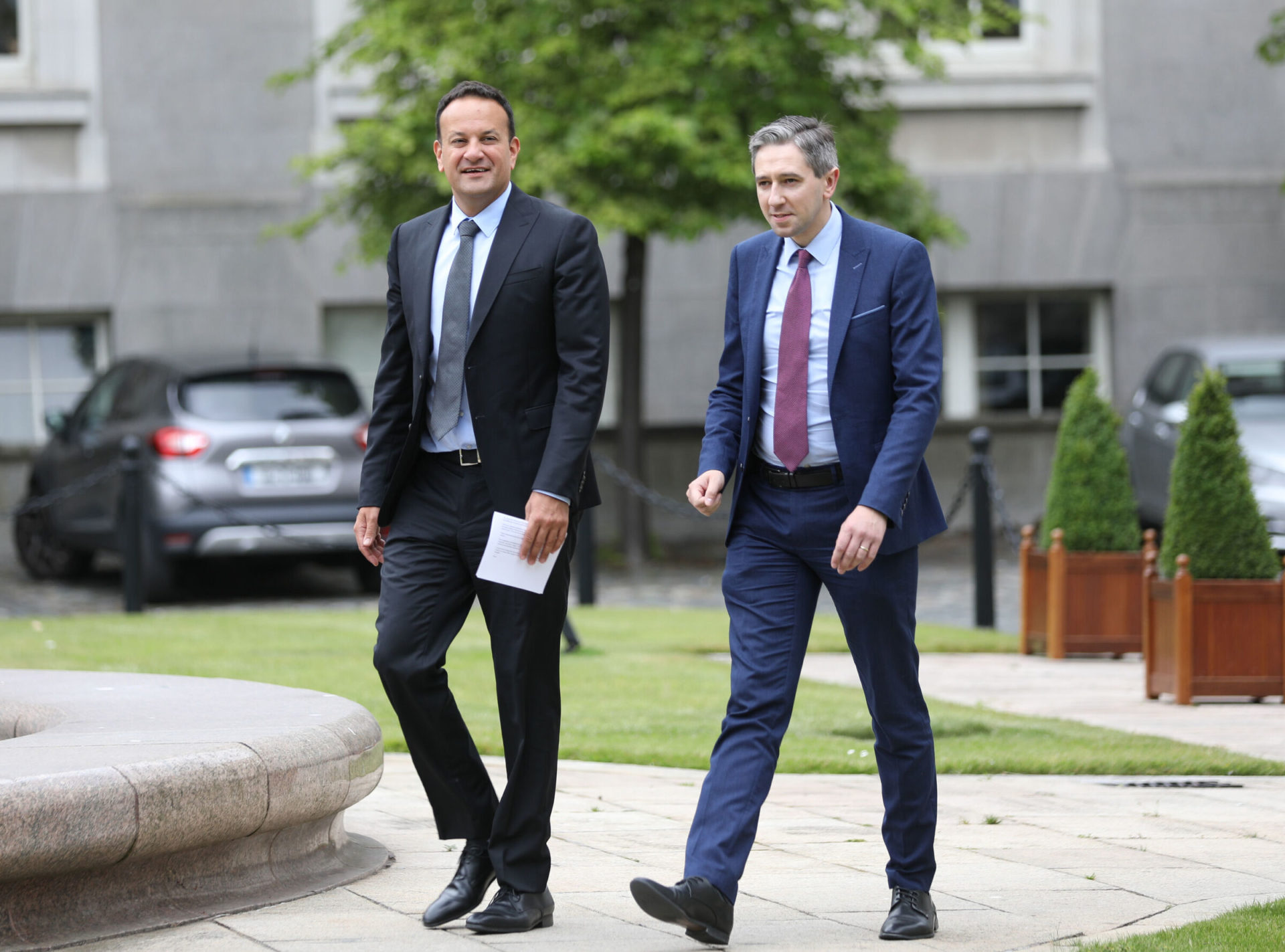 Outgoing Taoiseach Leo Varadkar and Minister Simon Harris in the courtyard of Government Buildings, 21-6-22.