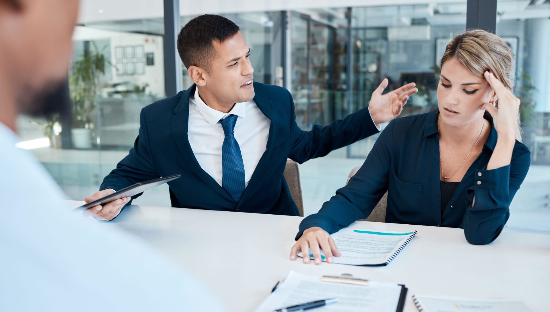 People arguing in a work setting