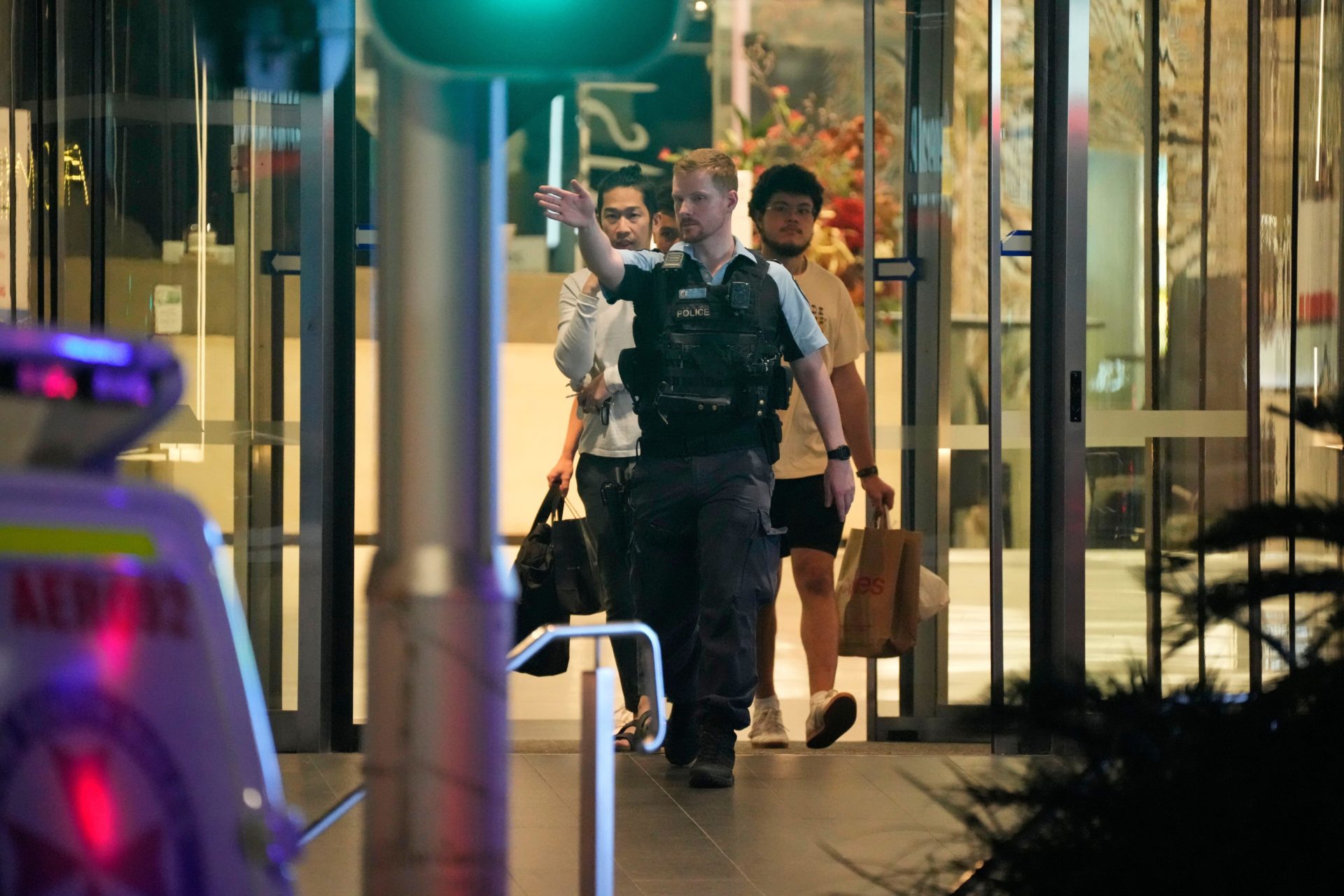 People led out of Westfield Shopping Centre, where multiple people were stabbed in Sydney, 13/04/2024. Image: AP Photo/Rick Rycroft