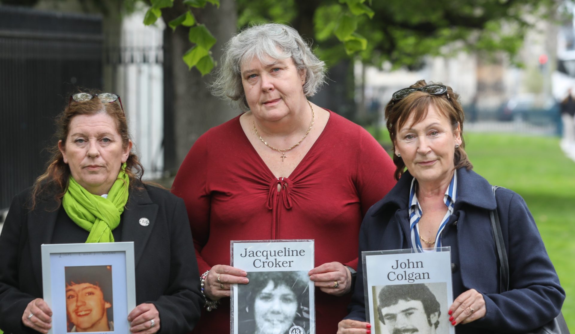 Pictured outside the Stardust Inquest holding portraits of victims (left to right): Susan Behan with portrait of John Colgan (21); Alison Keane with portrait of Jacqueline Croker (18); and Siobhan Kearney with portrait of Liam Dunne (18), 17-4-23.