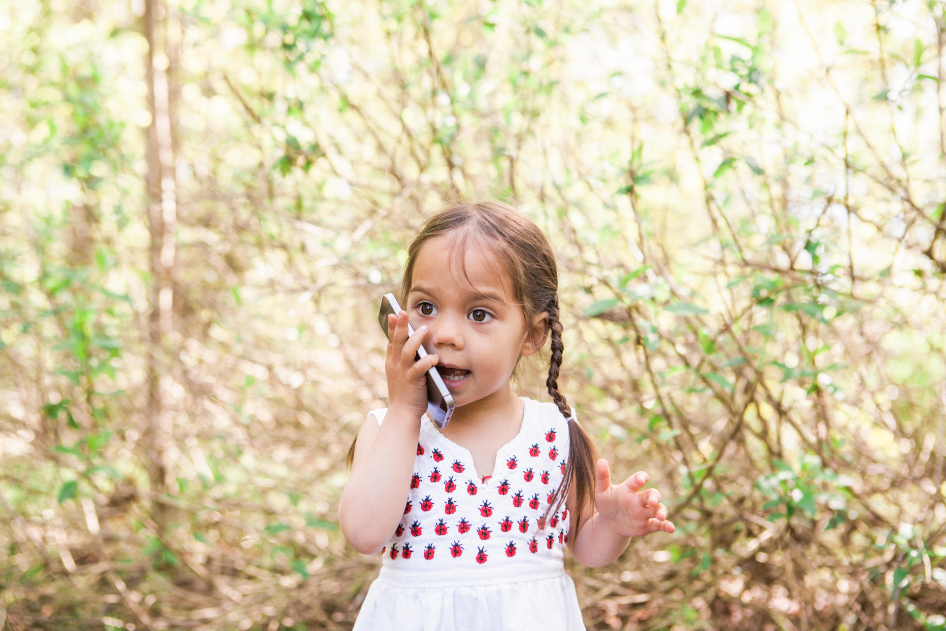 Toddler on phone talking. Image: caia image / Alamy Stock Photo