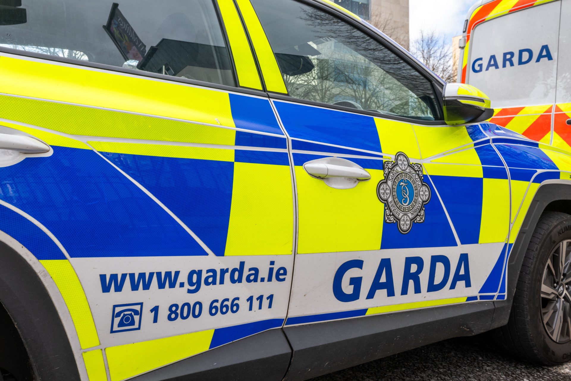Garda car and van parked in Cork, Ireland.