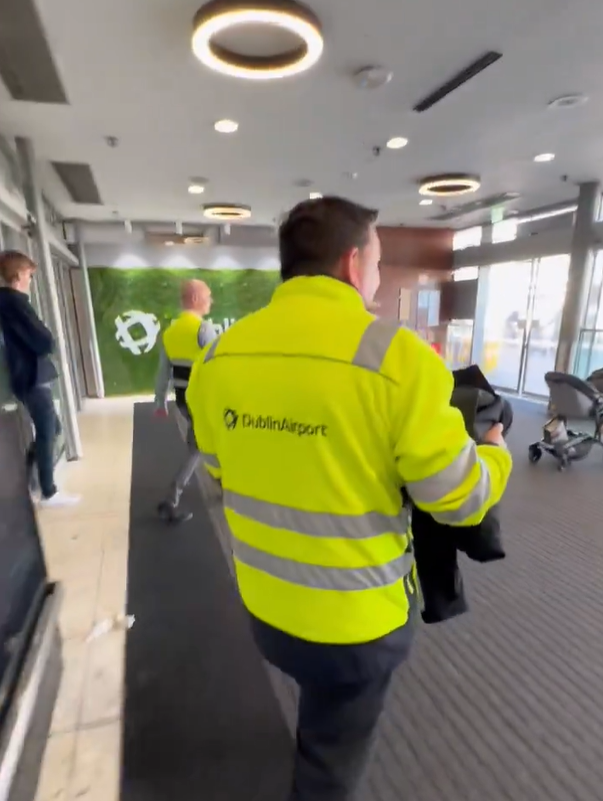 Video screenshot shows Dublin Airport workers helping Charlie outside, 23-4-24