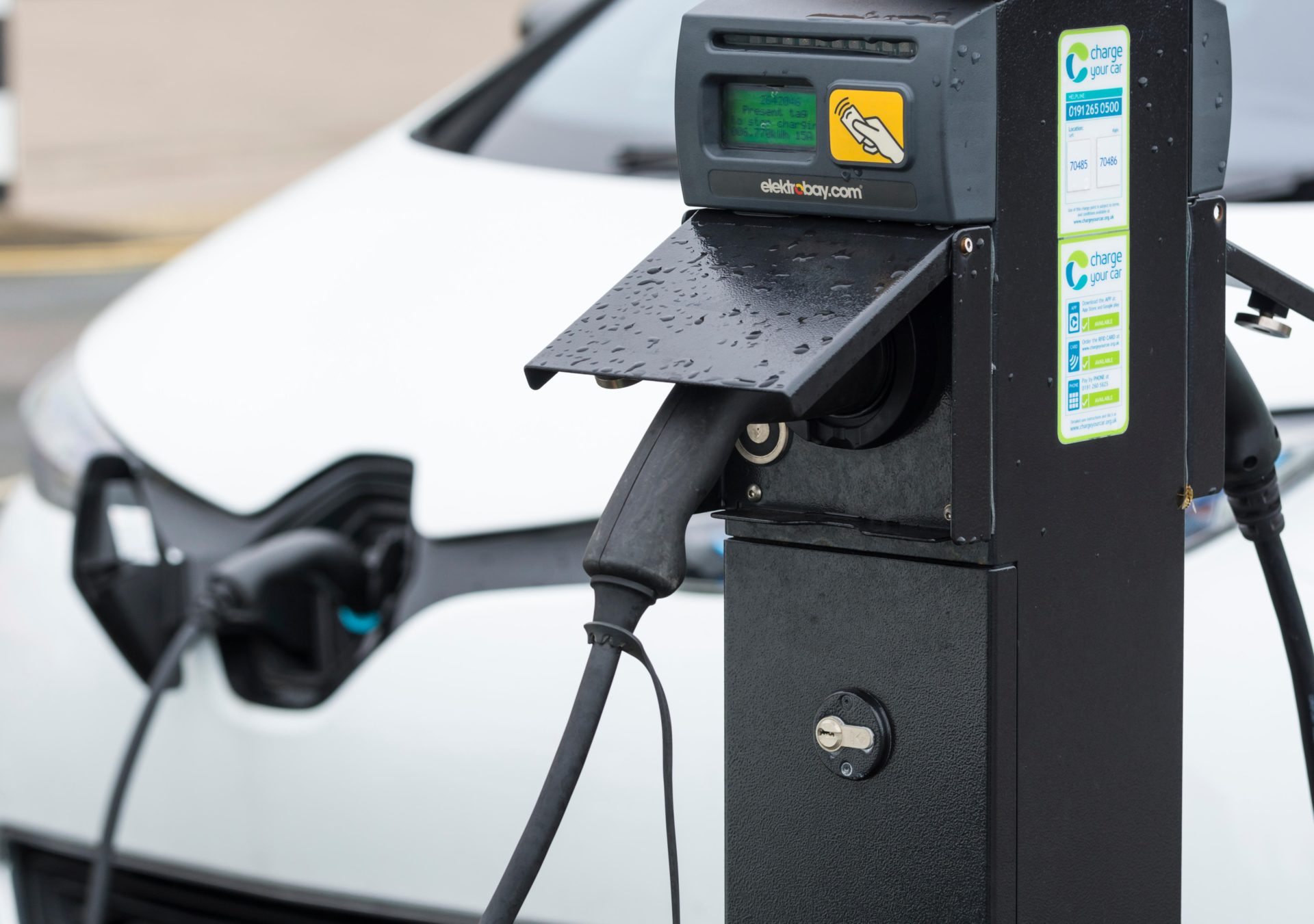 An EV charging point with an electric car plugged in, 26-7-17.