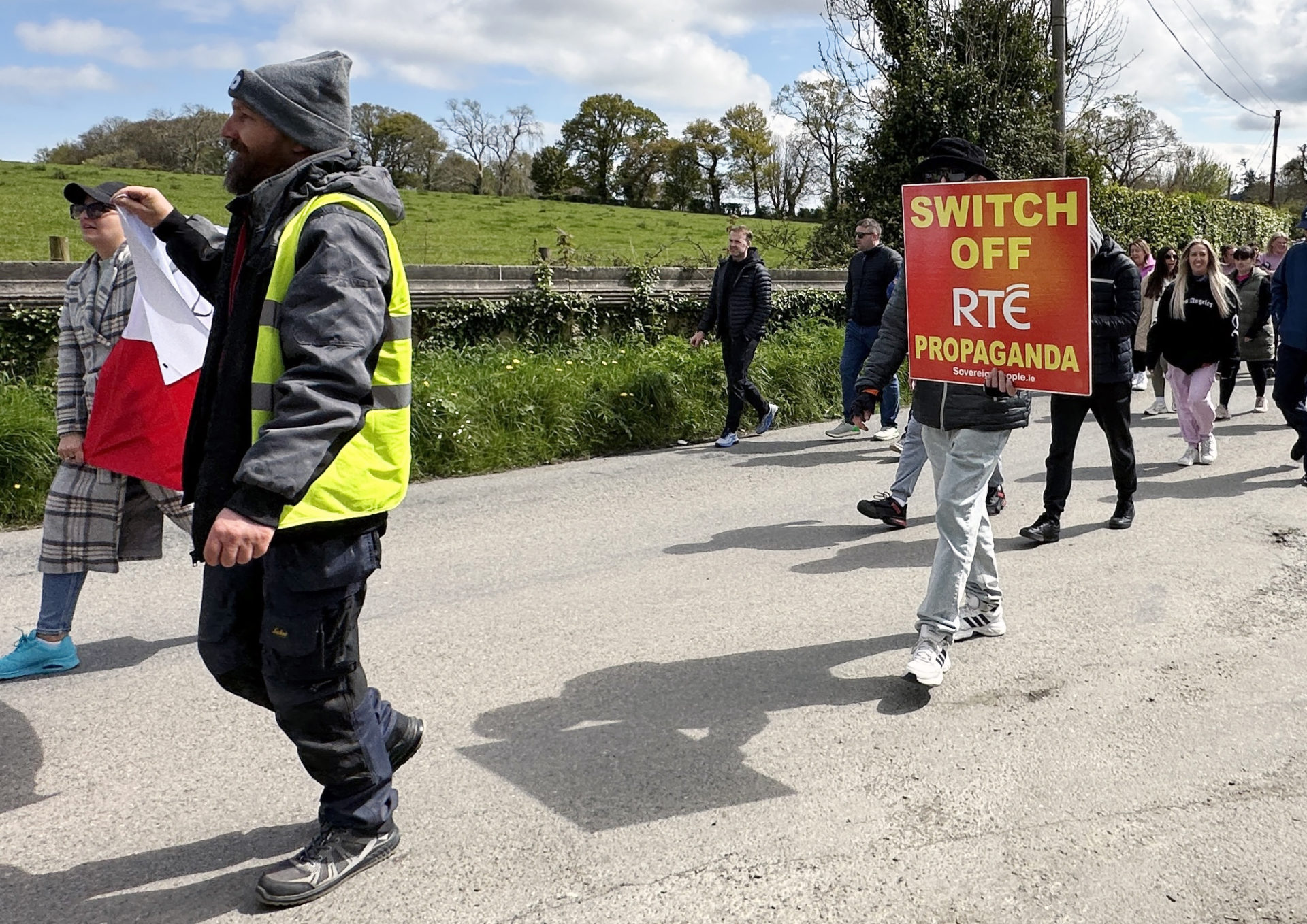 Protestors marching from Newtownmountkennedy against the use of local property for asylum seekers. Image: Eamonn Farrell/© RollingNews.ie