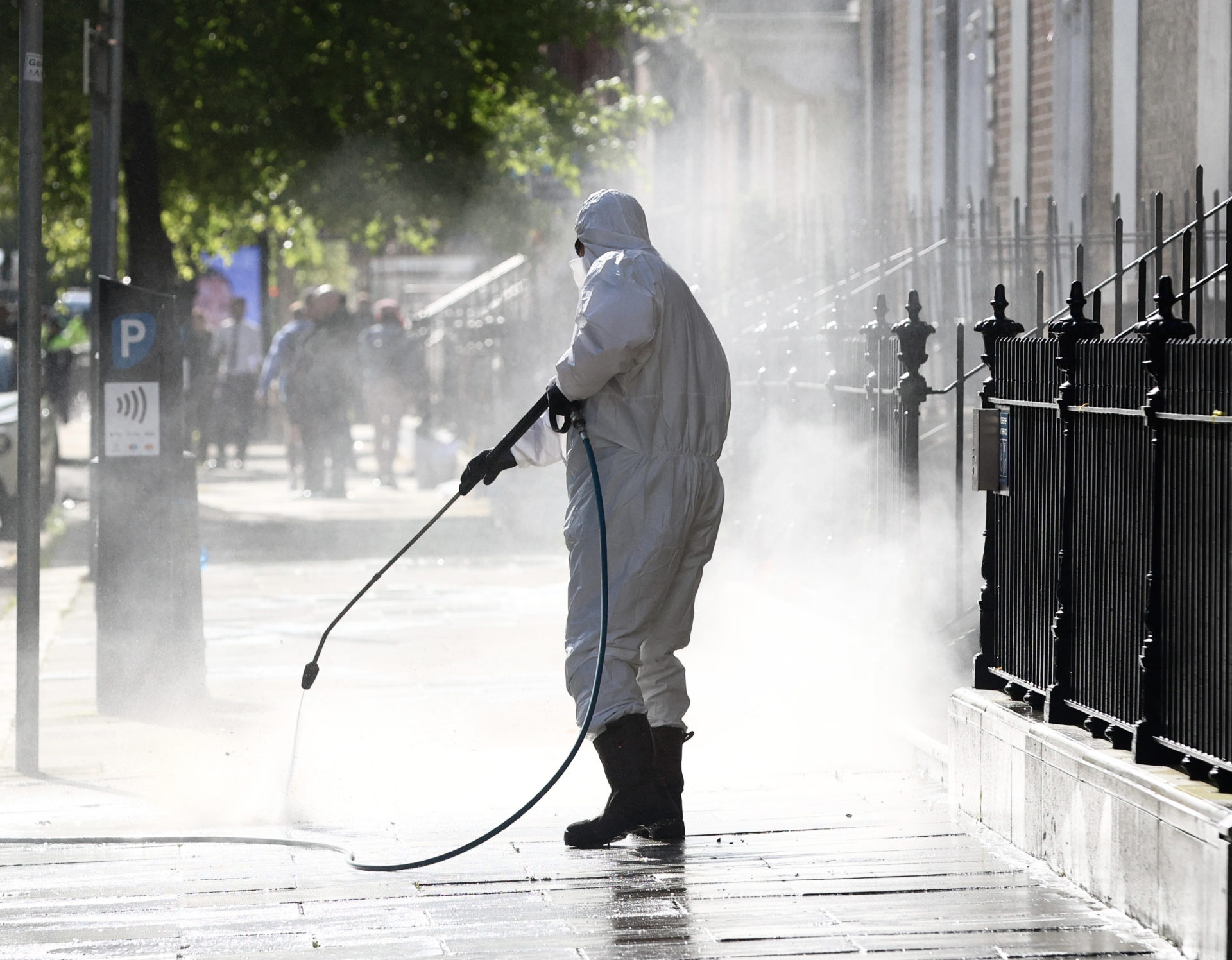 A worker cleans the path with a pressure washer after tents were removed from outside the International Protection Office on Dublin's Mount Street, 1-5-24.