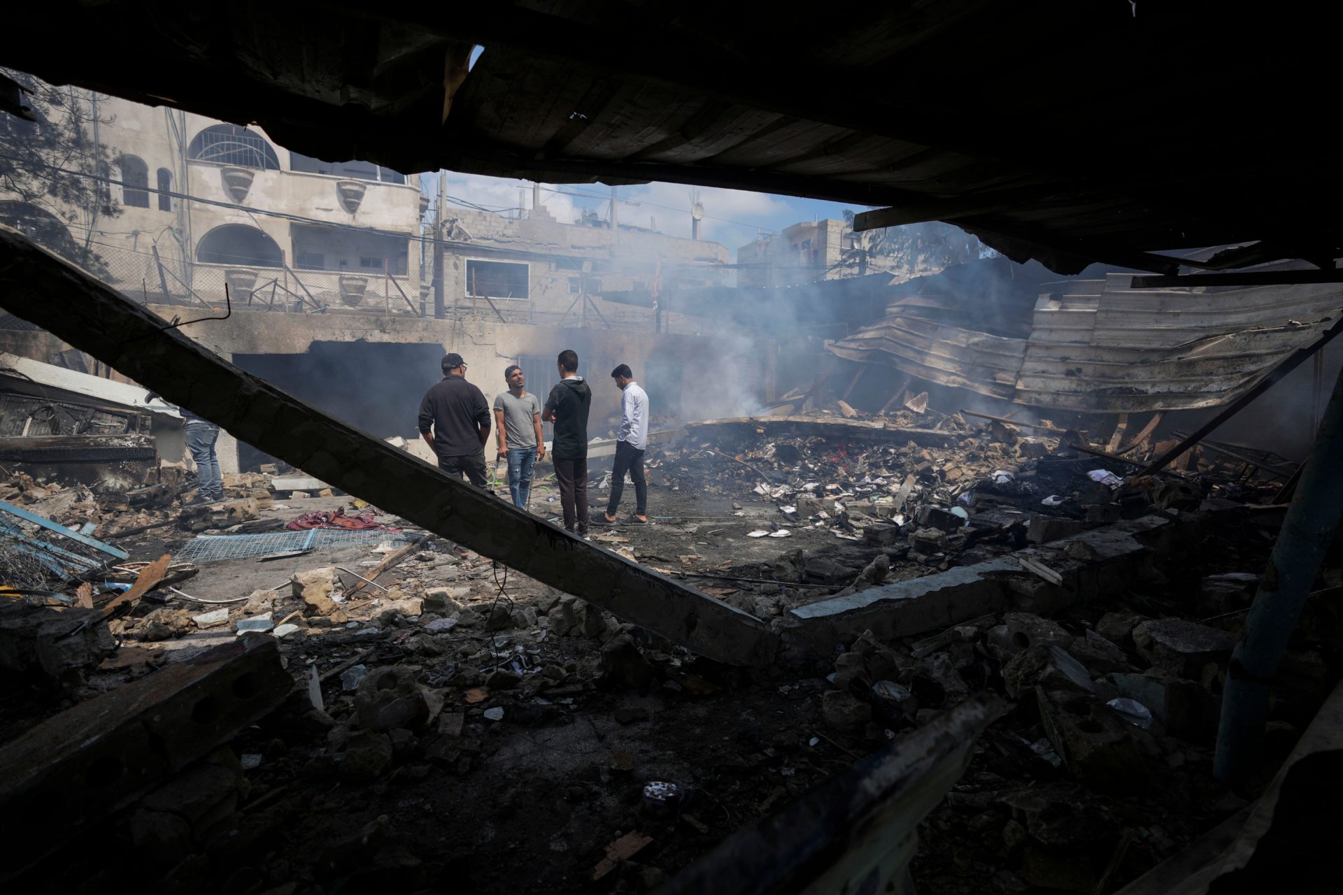 Palestinians in the rubble of a school in Nuseirat, Gaza Strip, 14/05/2024. Image: Associated Press / Alamy Stock Photo