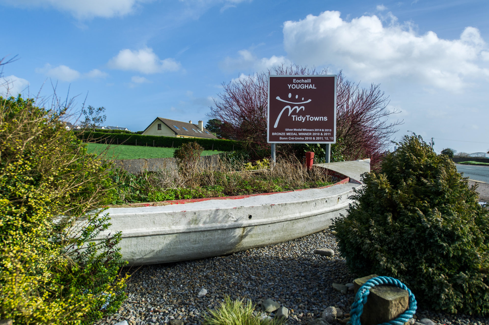 The Youghal Tidy Towns sign with a boat. Image: Andy Gibson / Alamy Stock Photo 