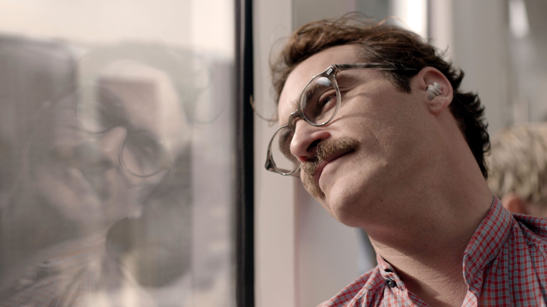 Joaquin Phoenix in Her, a film about a man who falls in love with an AI chatbot. Image: BFA / WB