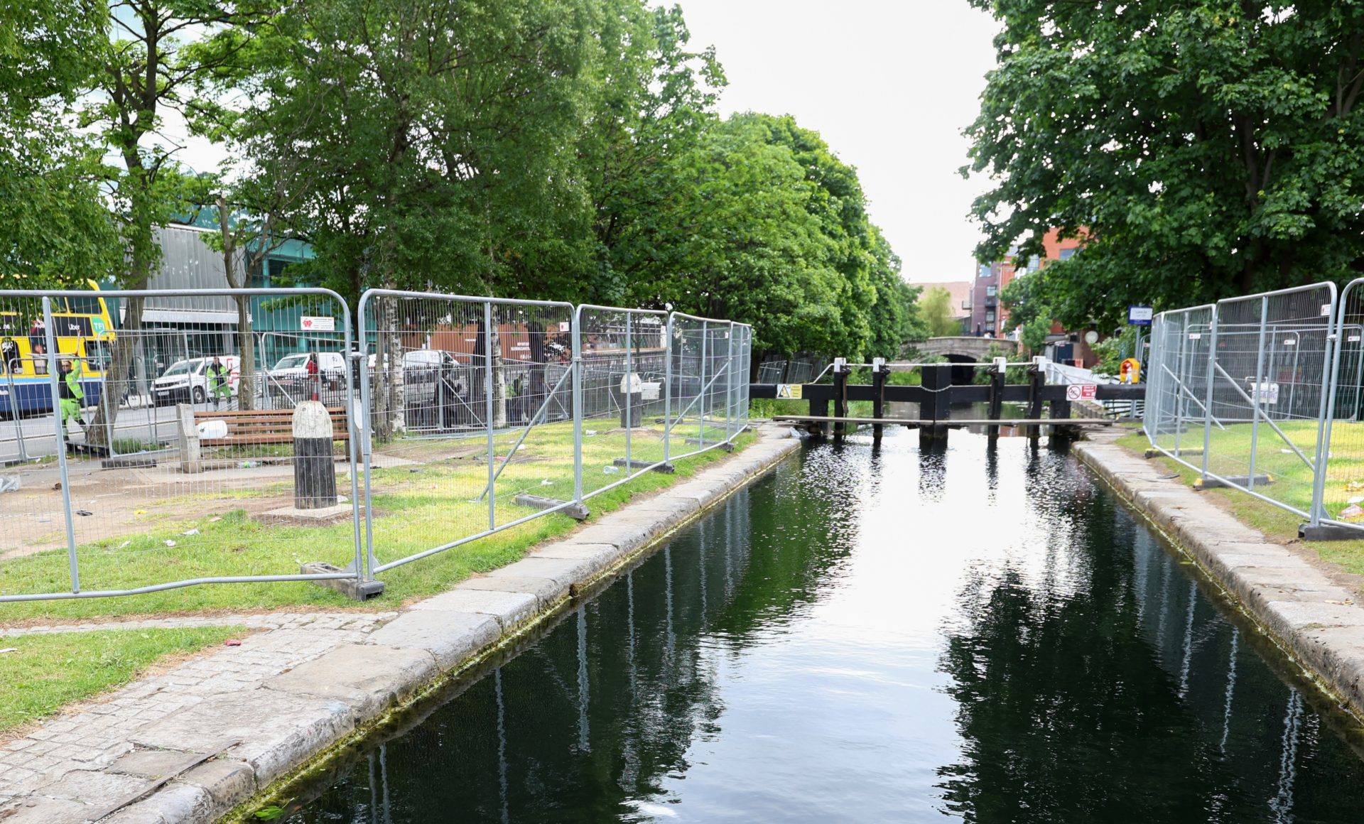 Dublin City Council workers performing a clean up operation after asylum seeker tents were removed from the banks of the Grand Canal, 30-5-24.