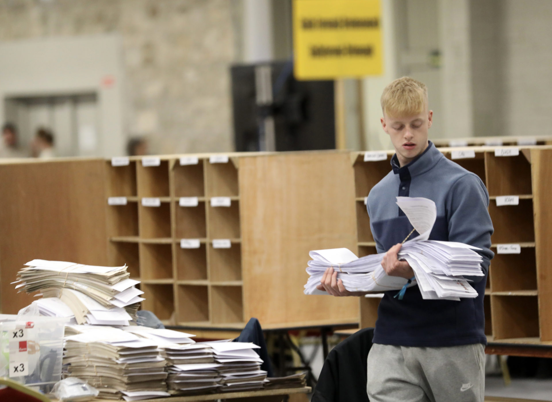 Staff carry ballot papers for the Local and European elections during the count at the RDS in Dublin, 8-6-24.