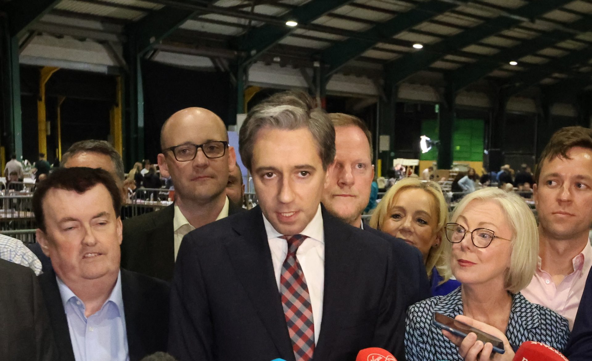 Taoiseach Simon Harris flanked by party members, speaks to media in the RDS count centre in Dublin, 9-6-24