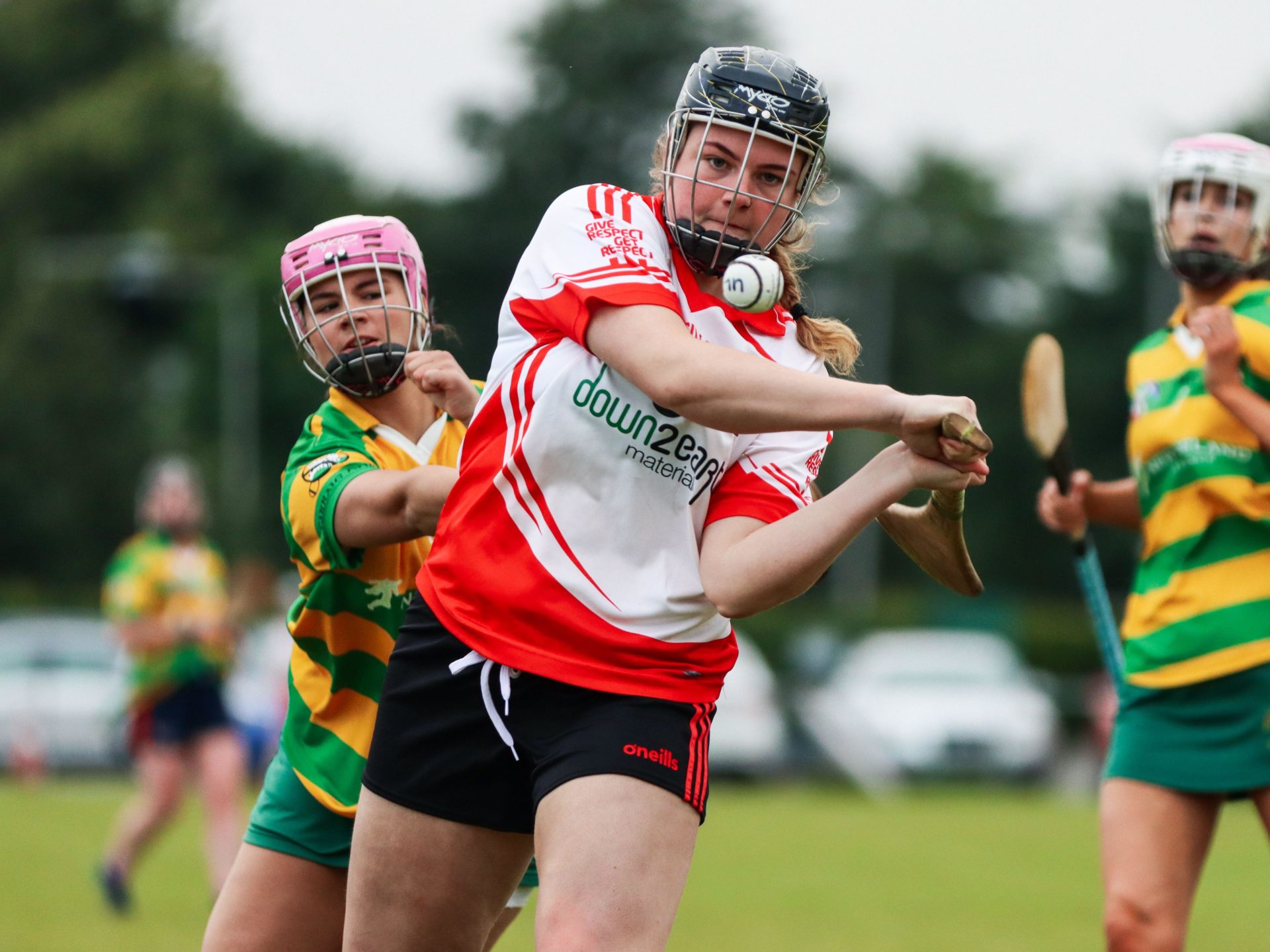 Women playing camogie.
