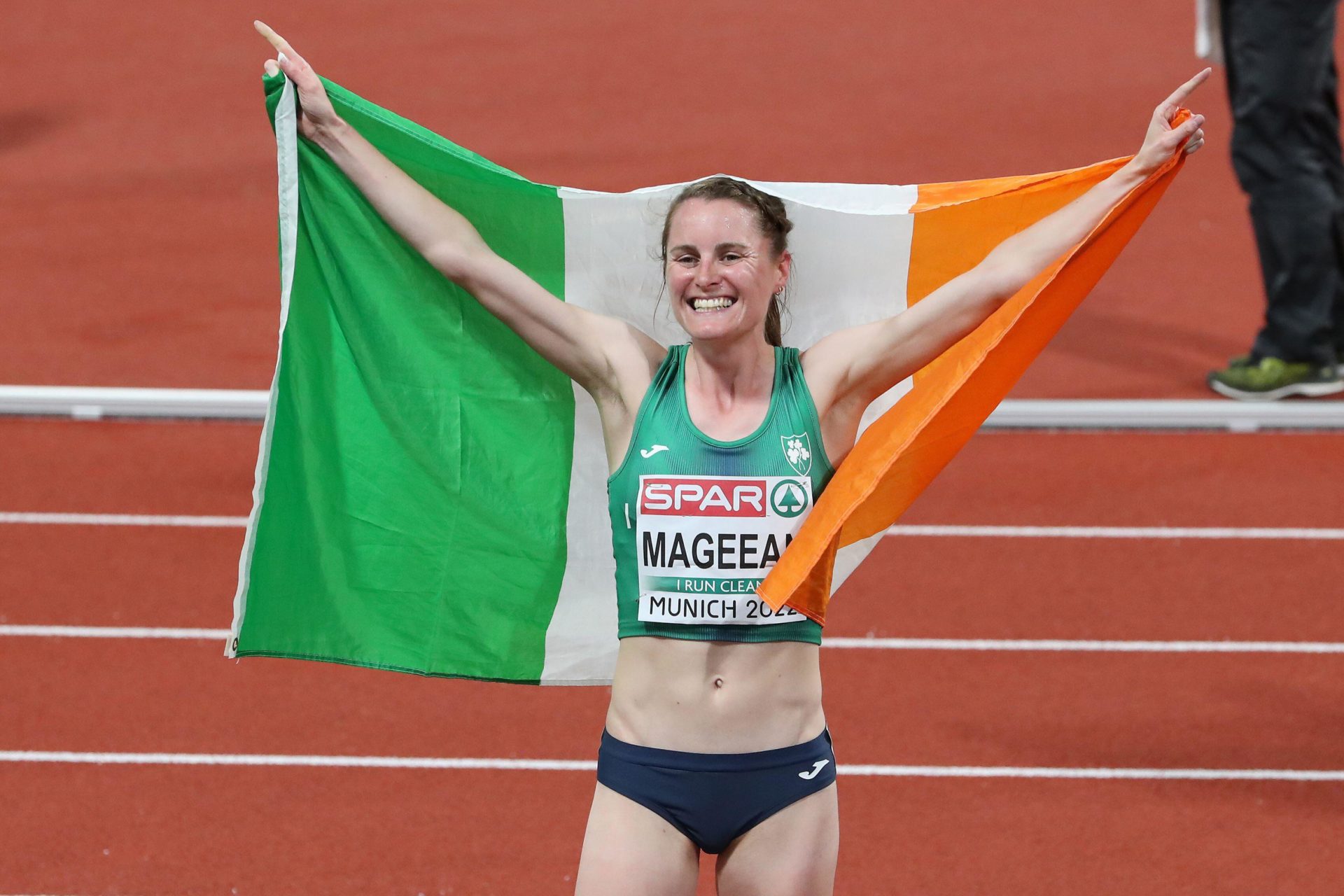 Ciara Mageean celebrating with the Irish flag after the Women's 1500m Final at the European Athletics Championship 2022. Image:Mark Easton / Alamy Stock Photo