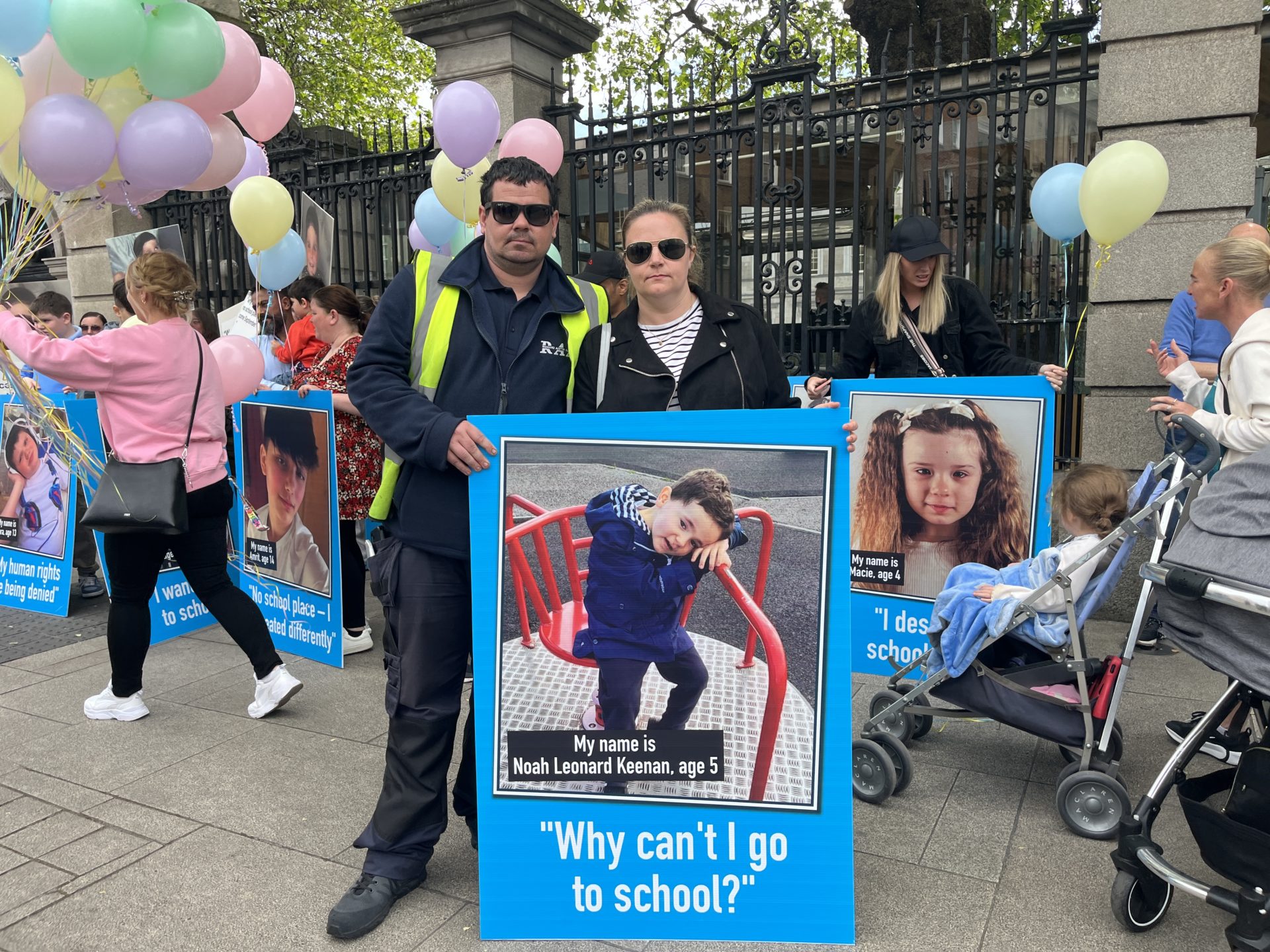 Carol Leonard and Stephen Keenan protest outside the Dáil about a lack of school places