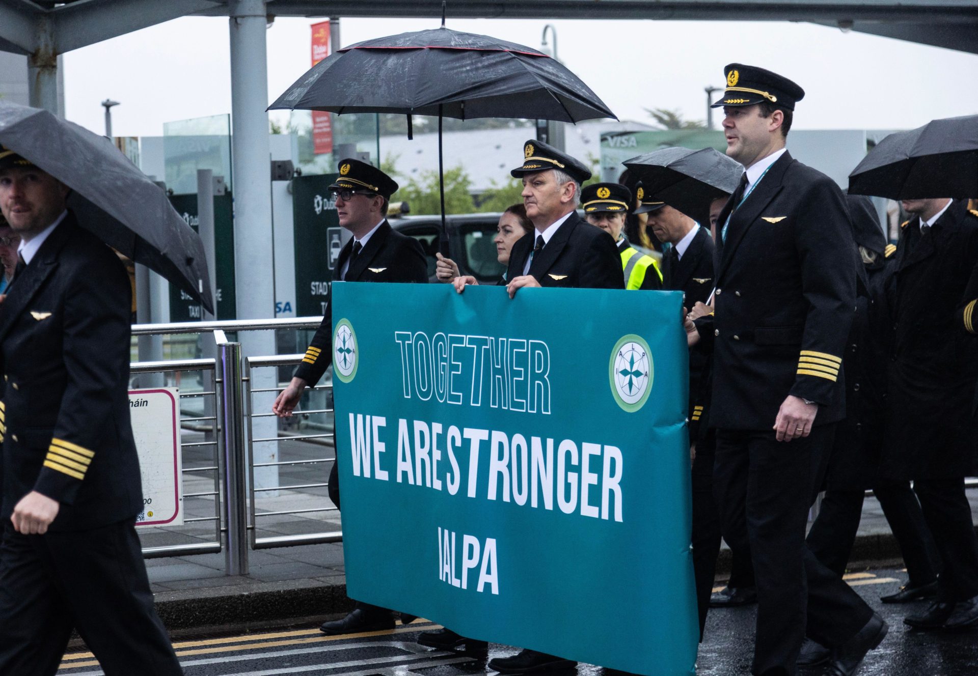 Aer Lingus pilots march around Dublin Airport as they begin their eight-hour strike