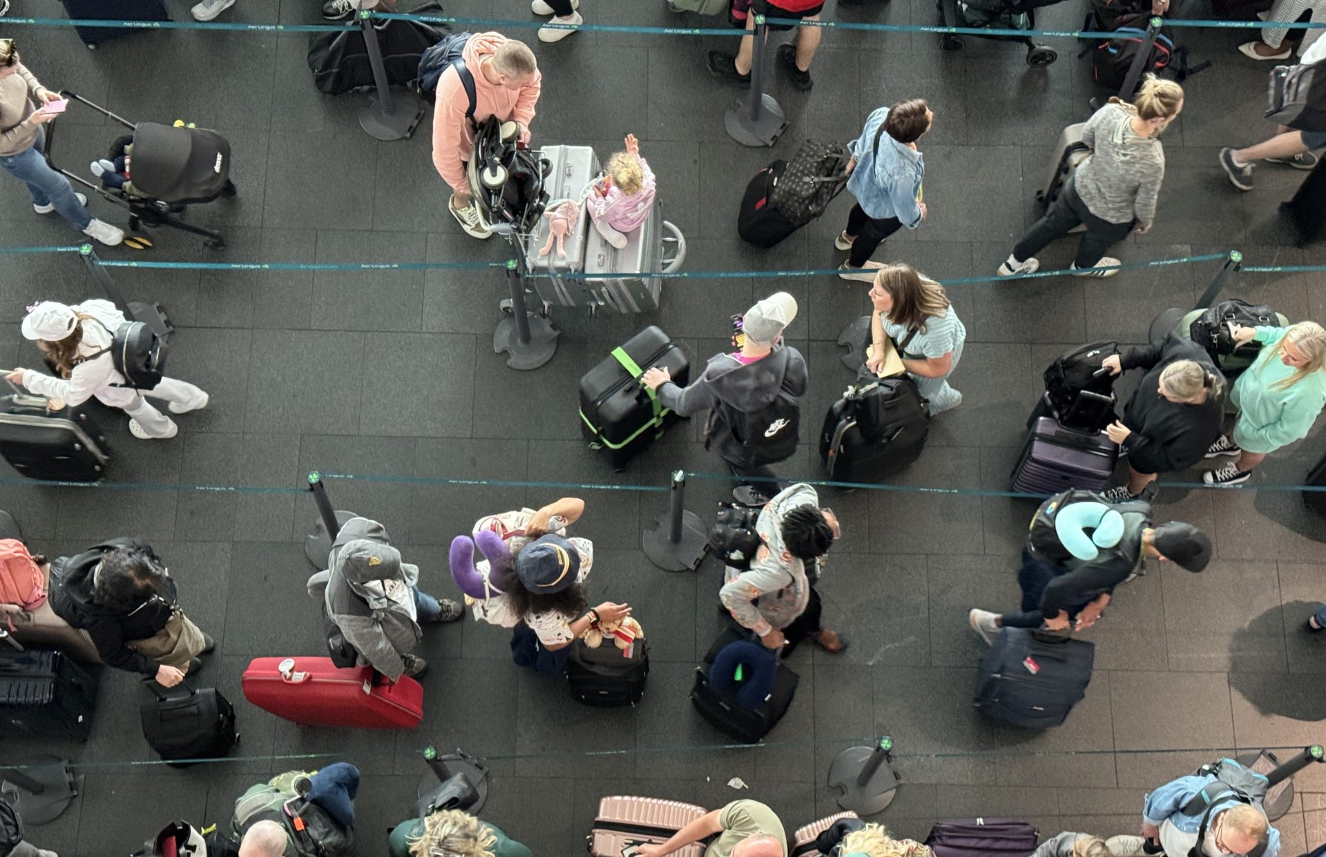 Passengers queueing at Aer Lingus check-in desks Dublin Airport