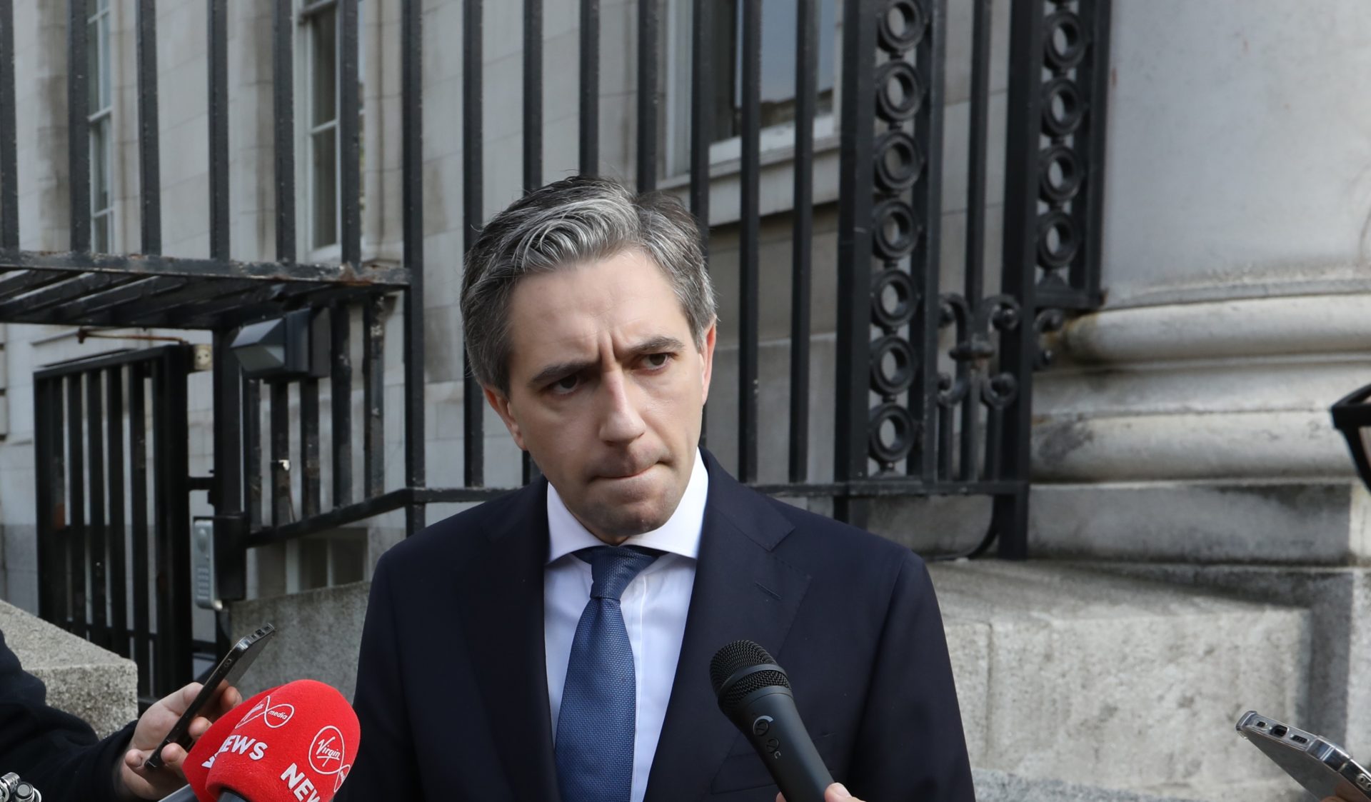 Taoiseach Simon Harris speaks to the media at a doorstep outside Government Buildings, 21-5-24.