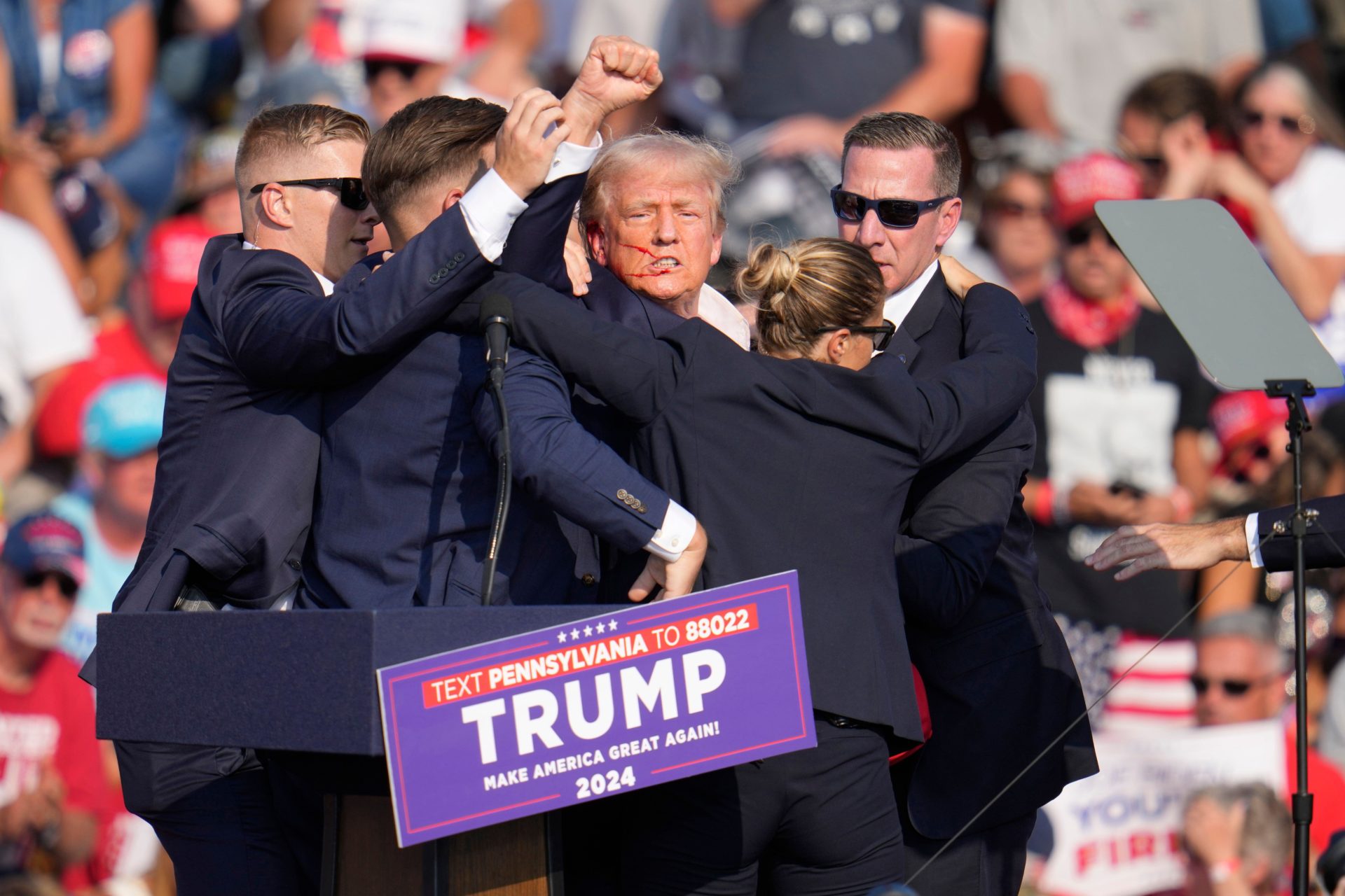 Republican presidential candidate former President Donald Trump surrounded by U.S. Secret Service agents at a campaign rally following an assassination attempt. Image: AP Photo/Evan Vucci