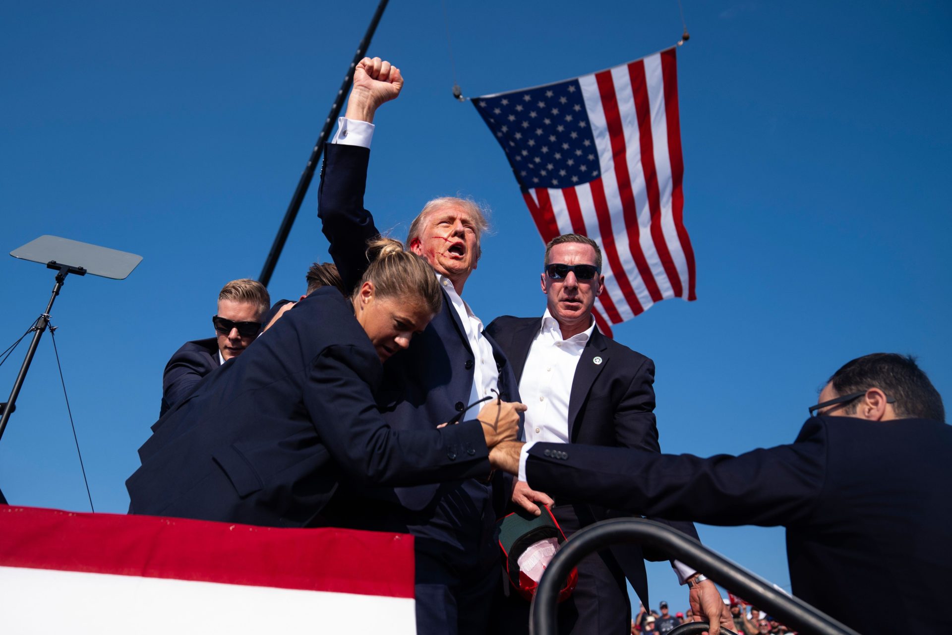 Republican presidential candidate former President Donald Trump surrounded by U.S. Secret Service agents at a campaign rally, Saturday, July 13, 2024, in Butler, Pa. (AP Photo/Evan Vucci)