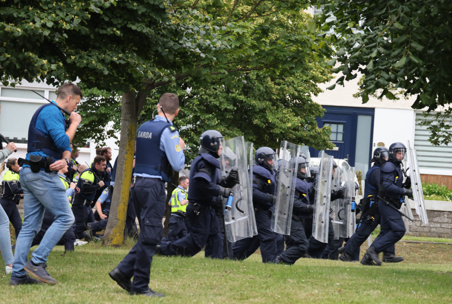 Members of the Gardaí and the Public Order Unit getting ready to baton charge protesters in Coolock, 15-7-24. 