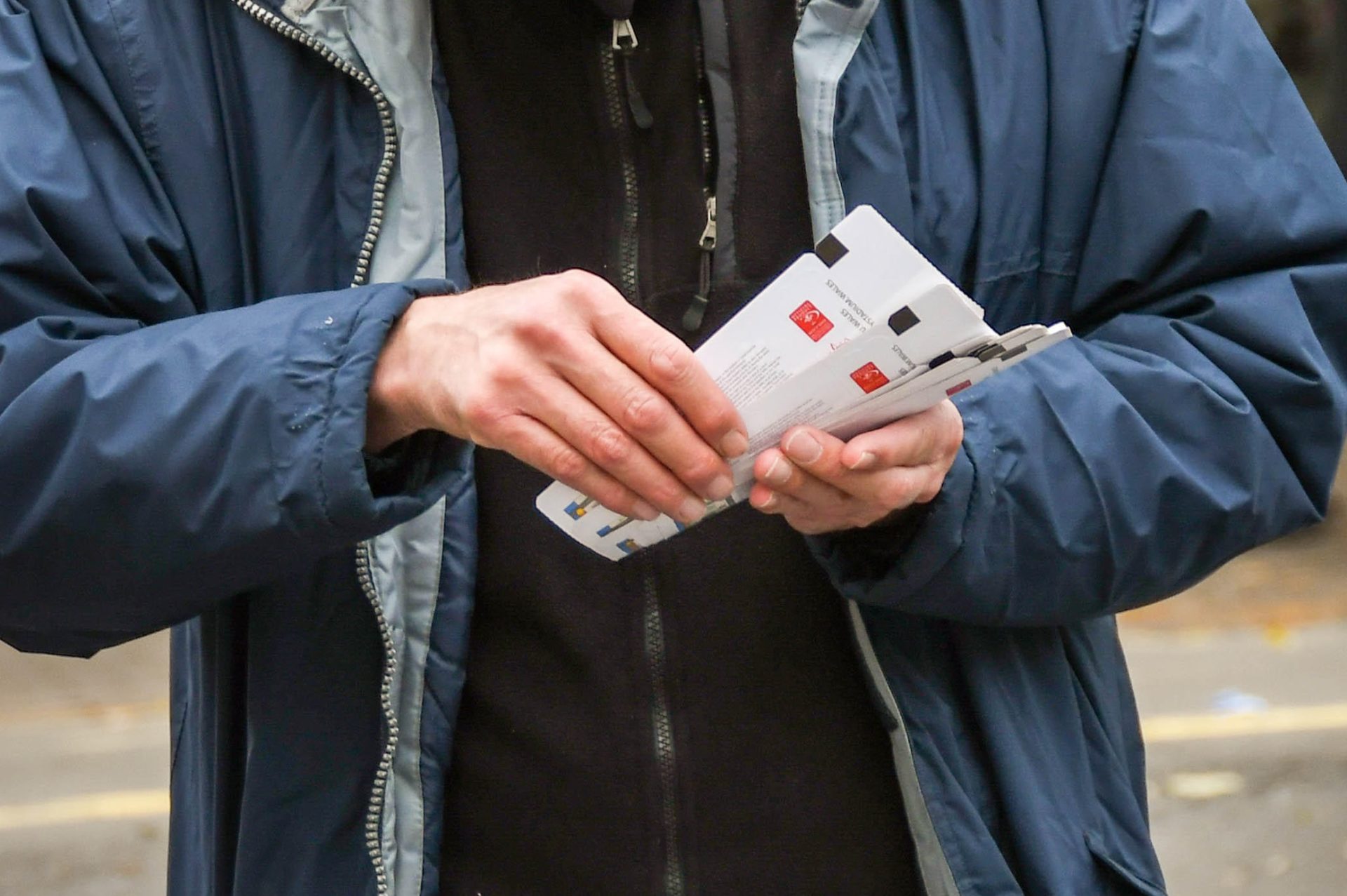 A person selling tickets for a sports event, 3-11-18