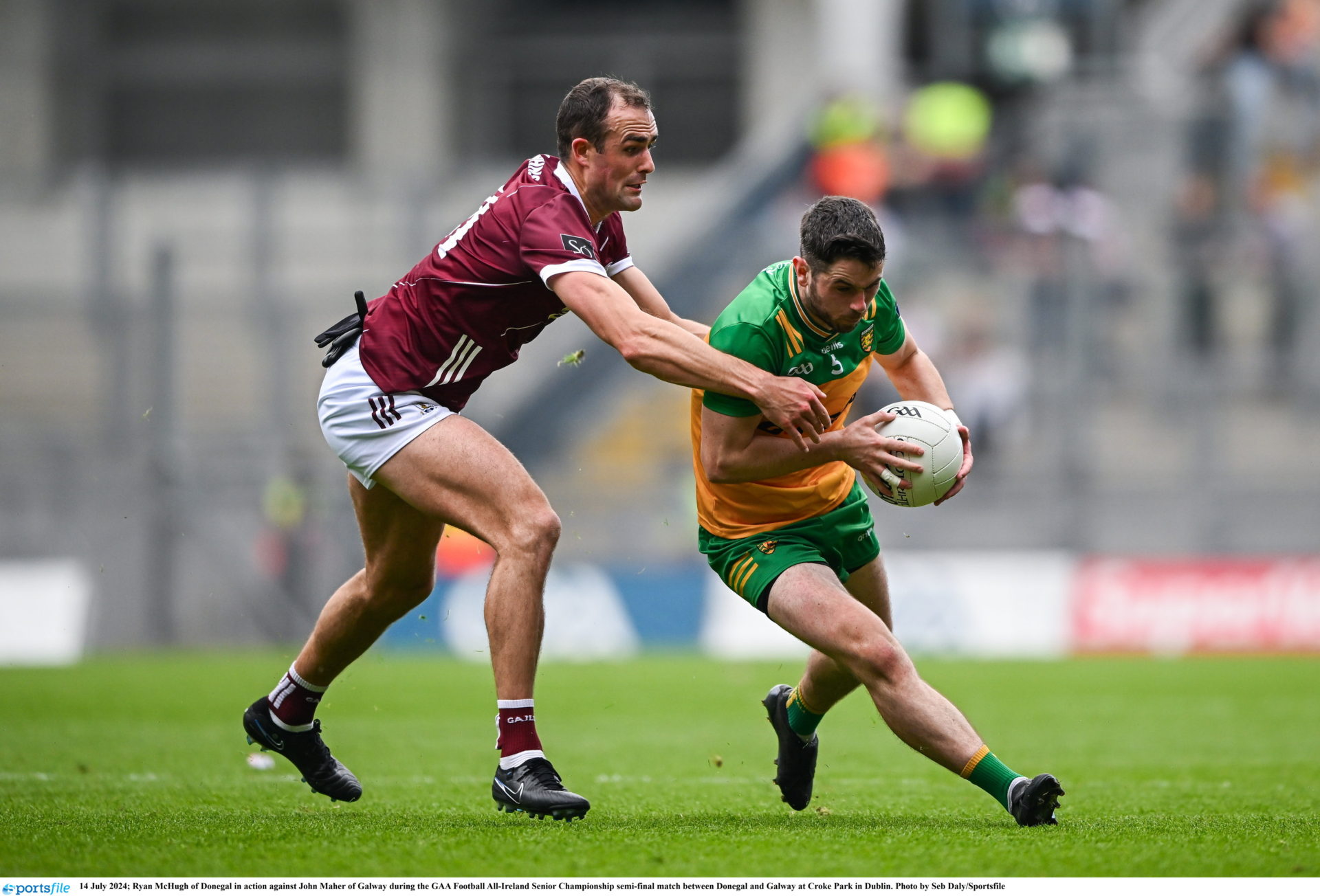 Ryan McHugh of Donegal in action against John Maher of Galway during the GAA Football All-Ireland Senior Championship semi-final match between Donegal and Galway at Croke Park in Dublin, 14/07/2024 Photo by Seb Daly/Sportsfile