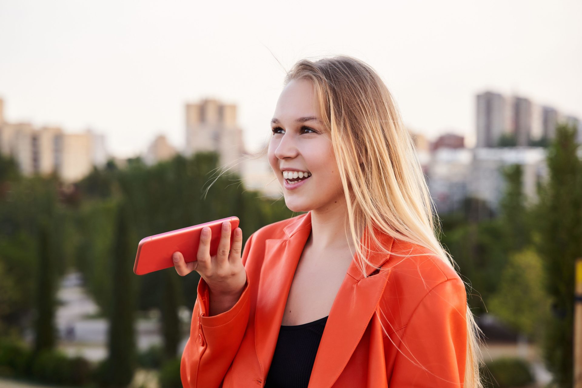 Girl sending a voice note on her phone. Image: Oscar Martin / Alamy Stock Photo
