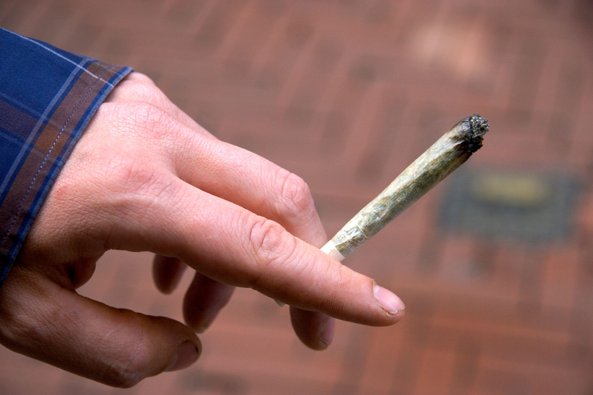 Hand holding a blunt of weed. Image: David R. Frazier Photolibrary, Inc. / Alamy Stock Photo 