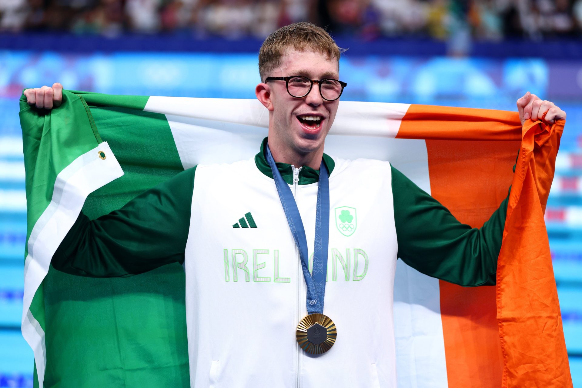 Ireland's Daniel Wiffen draped in the Tricolour with his gold medal at the Paris 2024 Olympic Games, 30-7-24.