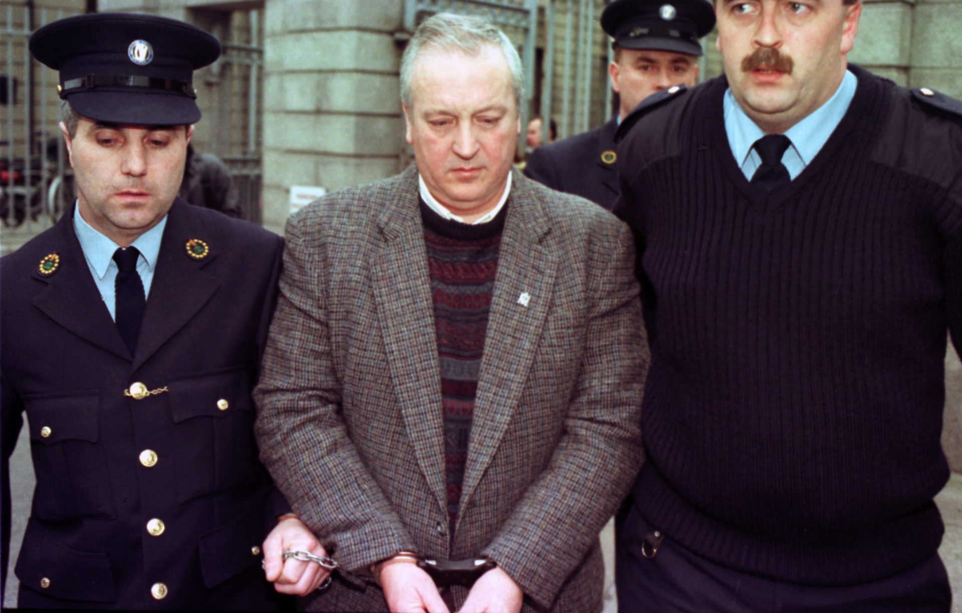 Former Irish National and Olympic swimming coach Derry O'Rourke is led out of The Central Criminal Court after he was given a 12 Year sentence for sexually abuse of young female swimmers