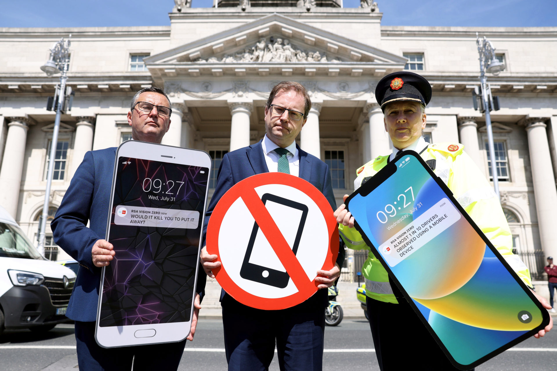 Minister of State James Lawless (centre) with RSA CEO Sam Waide and Assistant Garda Commissioner Paula Hilman launch survey showing an increase in the number of drivers using mobile phones, 31-7-24