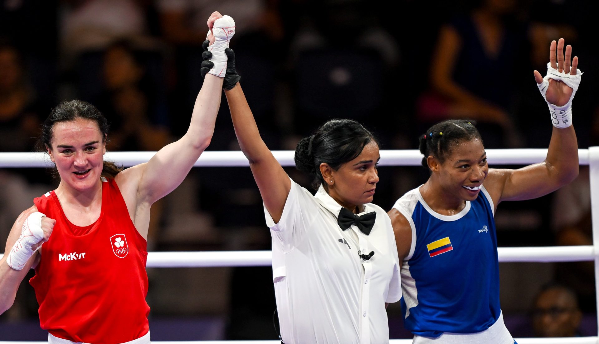 Kellie Harrington is awarded the win over Angie Paola Valdes Pana of Colombia by referee Nelka Thampu in their women's 60kg quarterfinal bout at the 2024 Paris Olympics