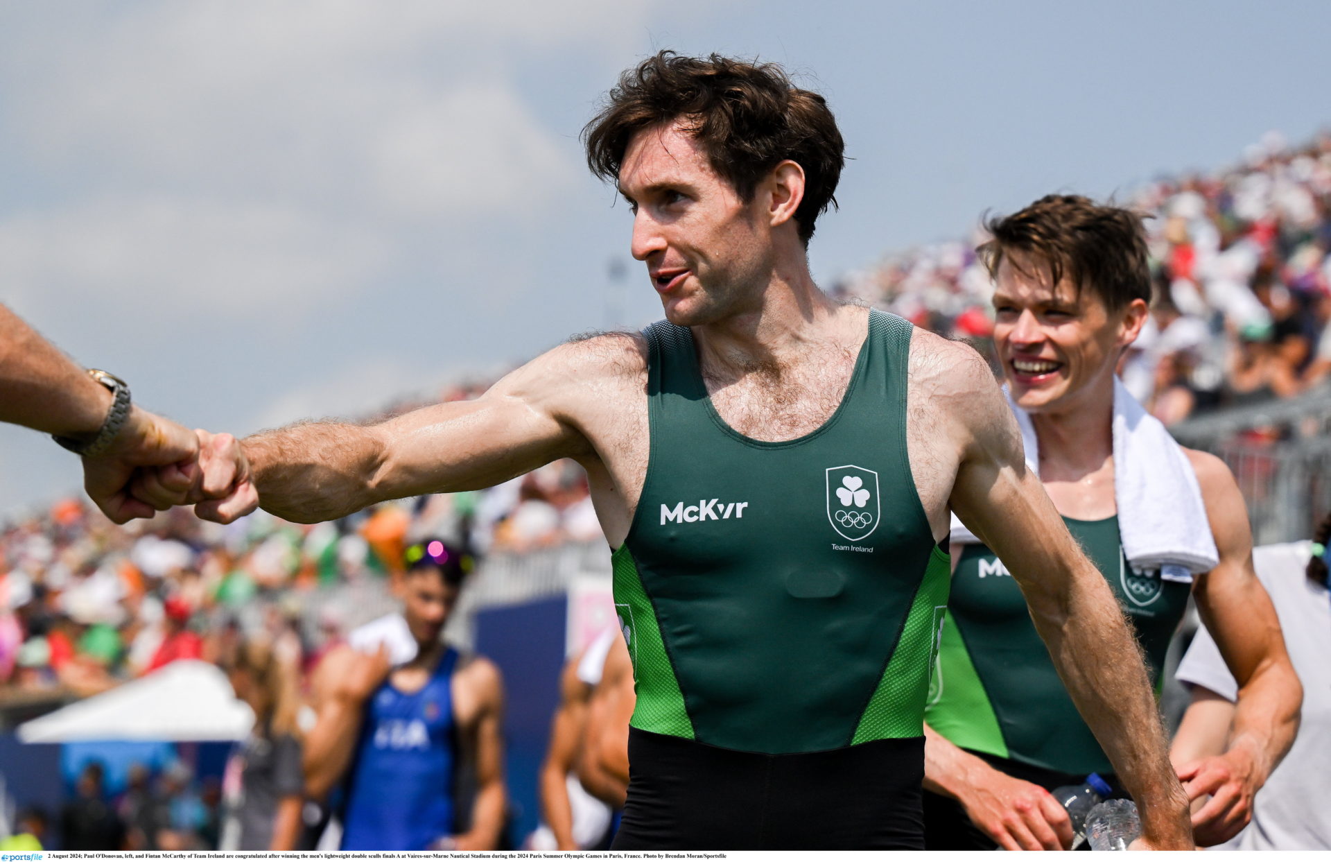 Paul O'Donovan and Fintan McCarthy on their way to receive their gold medal for Olympic Men's Lightweight Rowing Double Sculls. Photo by Brendan Moran/Sportsfile