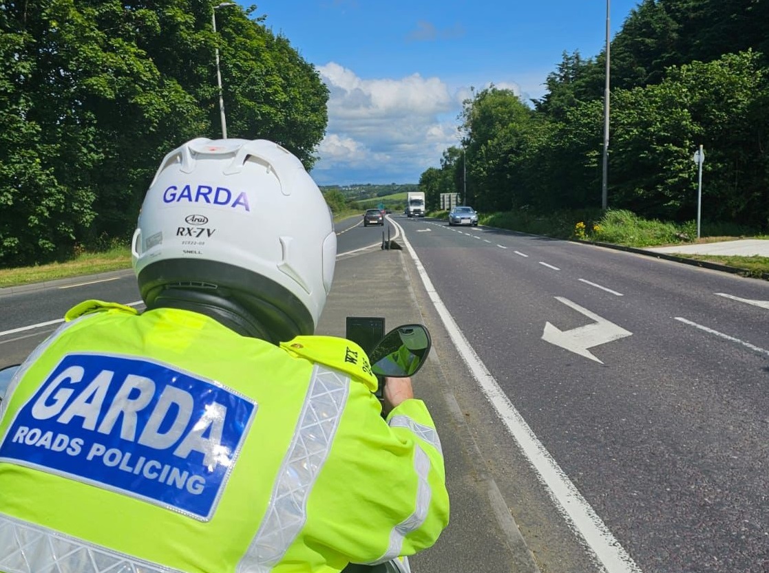 A Garda from the Roads Policing Unit carrying out a speeding checkpoint using his mobility device, 21-7-24.