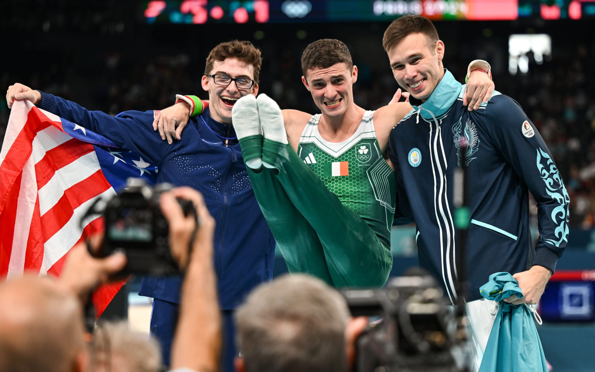 Silver medalist Nariman Kurbanov of Team Kazakhstan, left, Gold medalist Rhys McClenaghan of Team Ireland, centre, and bronze medalist Stephen Nedoroscik of Team US after the Olympics Men's Pommel Final. Image: Stephen McCarthy/Sportsfile